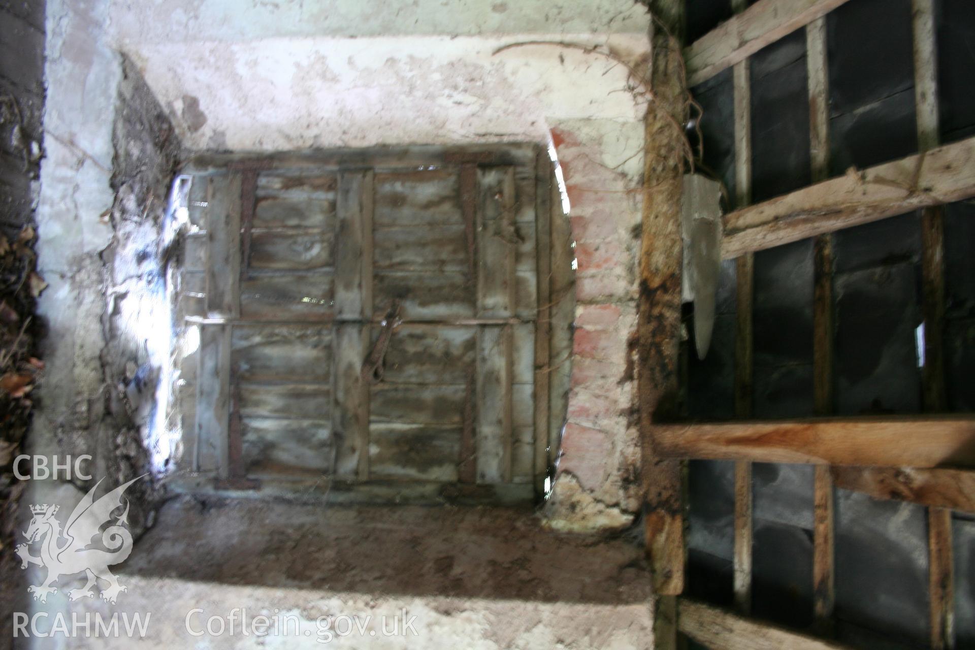 Interior of cow/house stable showing stable first-floor granary window.