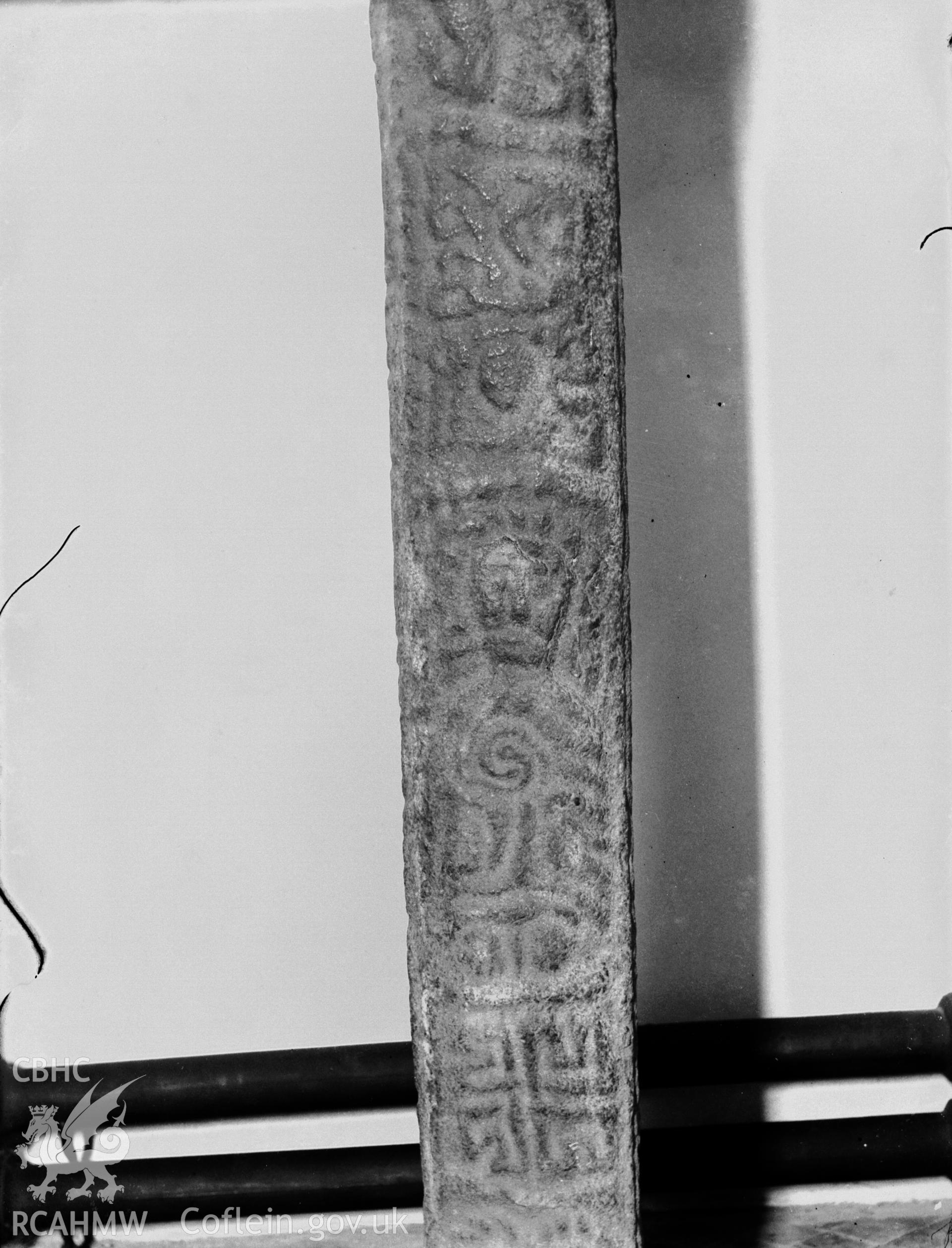 Black and white photo showing inscribed stone at Llanbadarn Fawr Church.