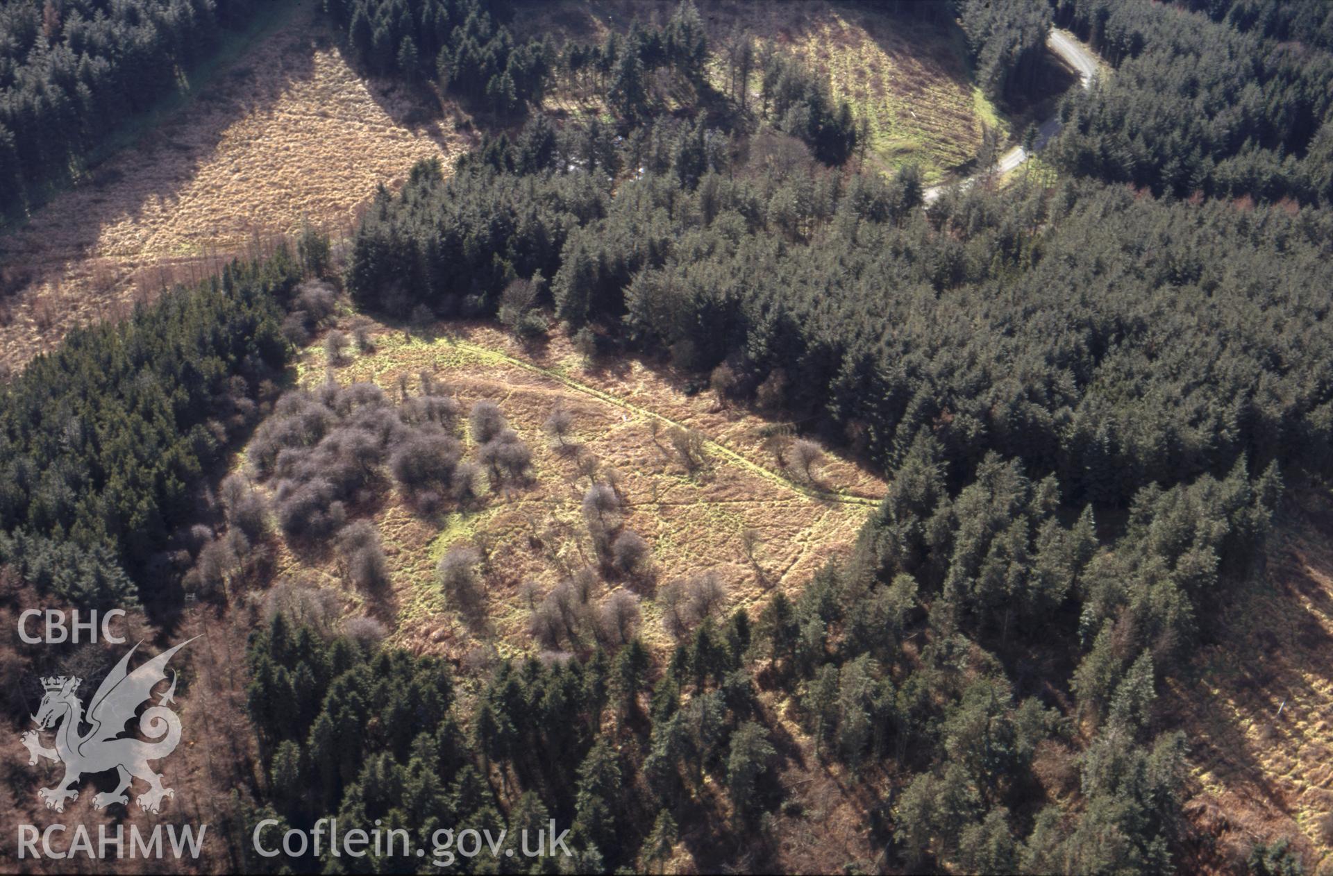 RCAHMW colour oblique aerial photograph of New Pieces Settlement , Breidden. Taken by C R Musson on 26/02/1995