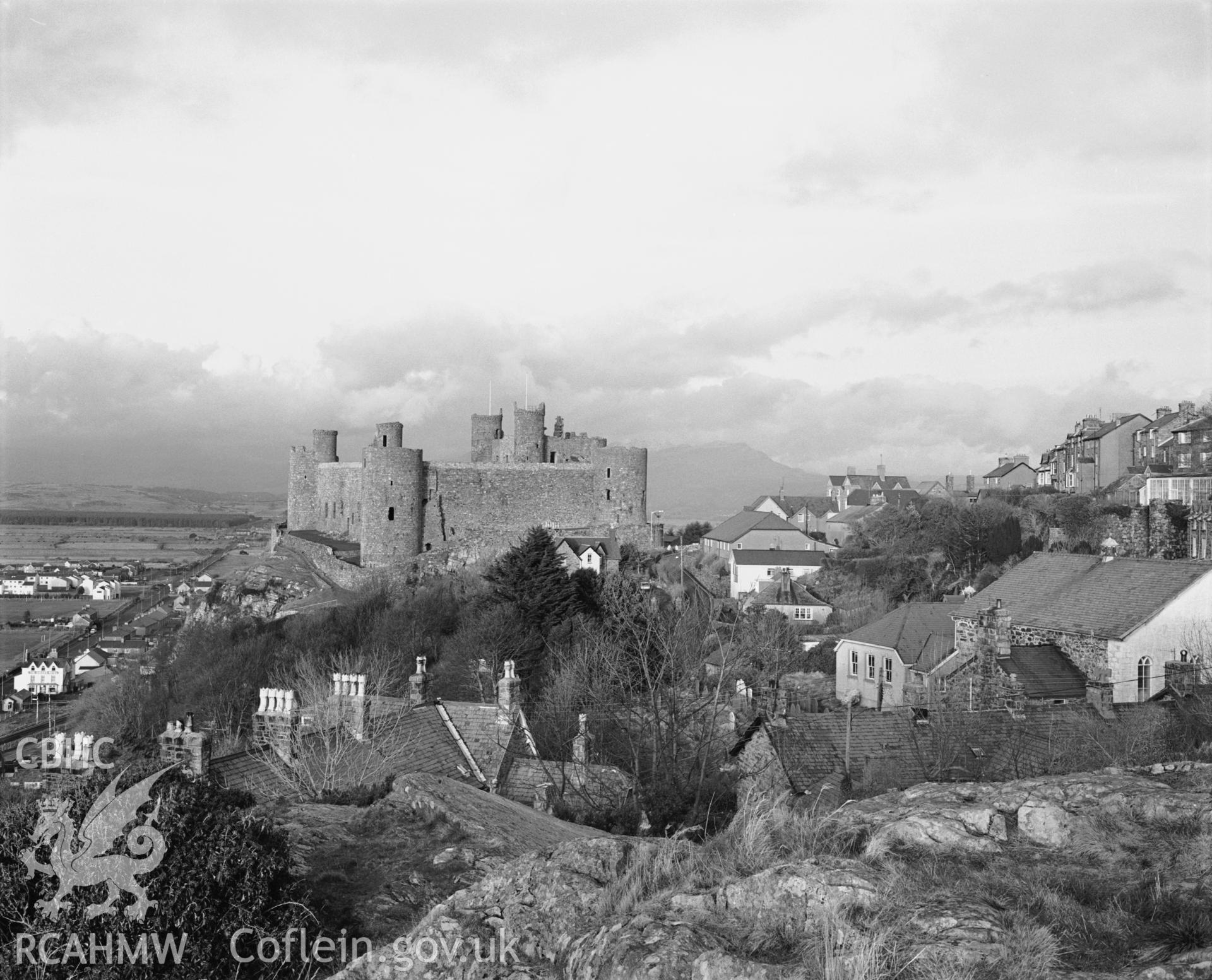 Photographic negative showing view of Harlech, including the castle; collated by the former Central Office of Information.