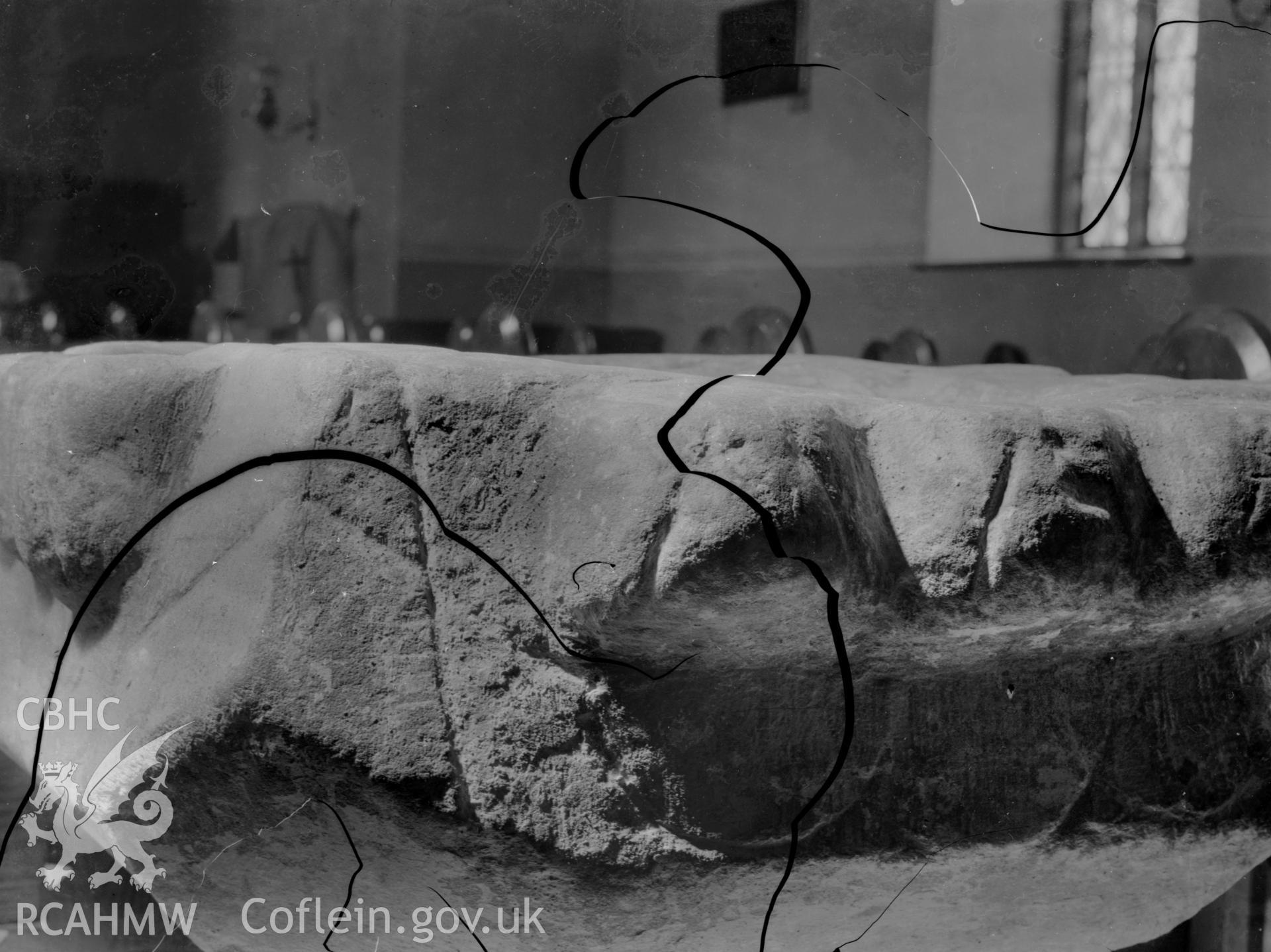 Black and white photo showing the font at Llanfair Orllwyn Church.