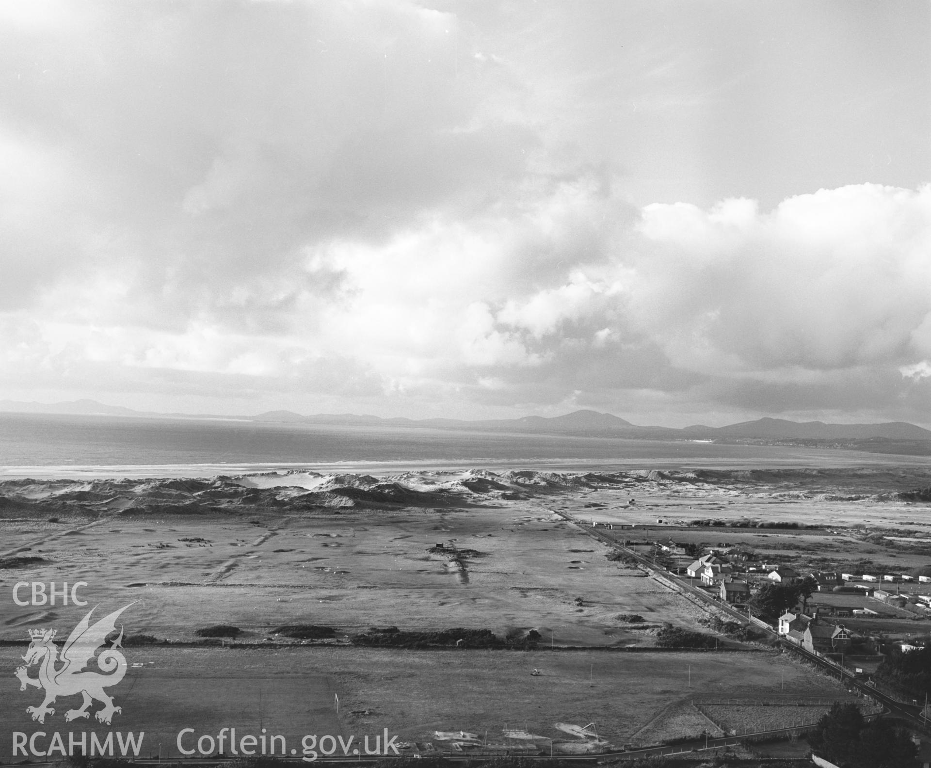 Photographic negative showing aerial oblique view of new housing at Harlech; collated by the former Central Office of Information.