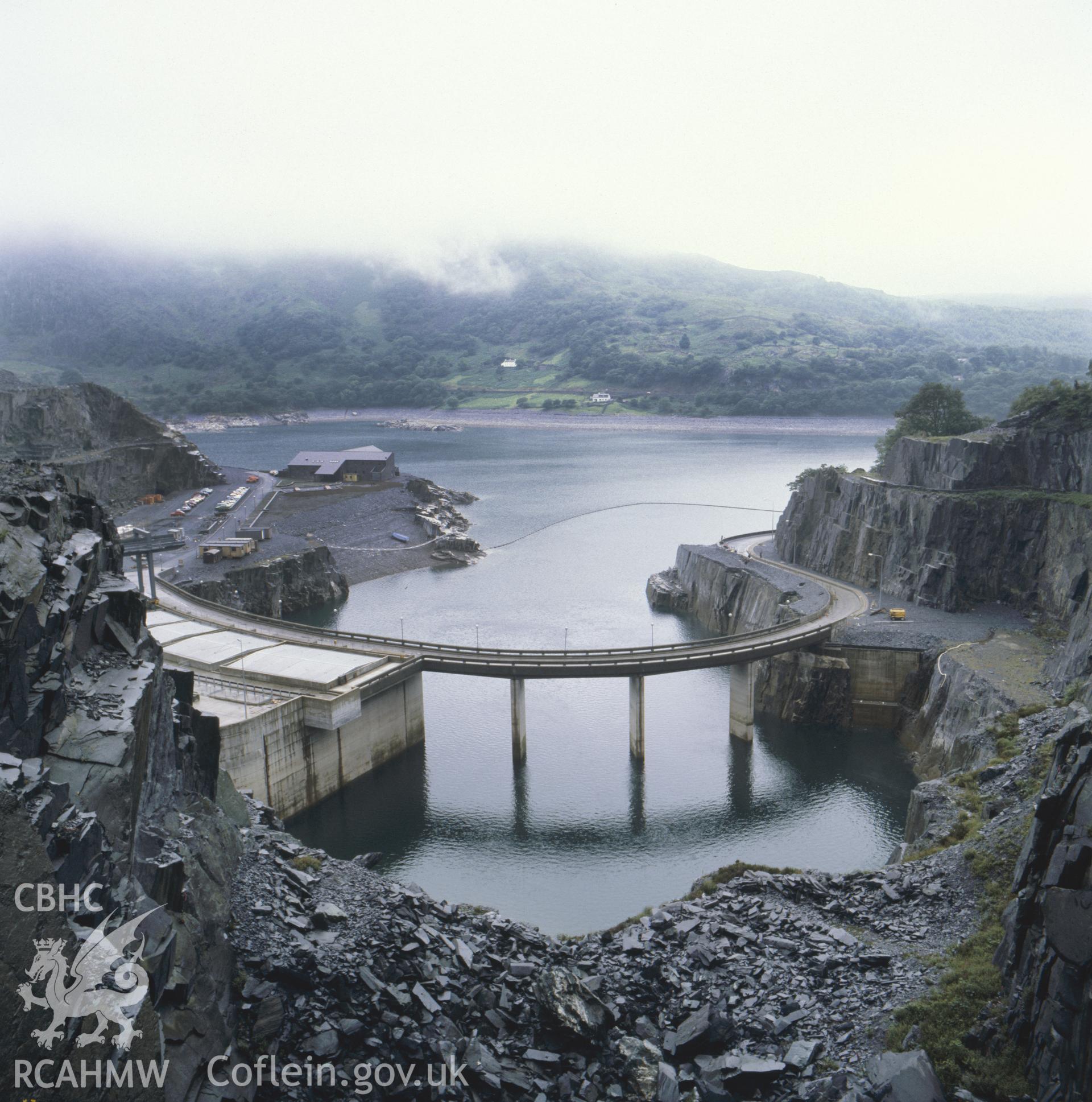 1 colour transparency showing lake and circular road at Dinorwig Power Station; collated by the former Central Office of Information.