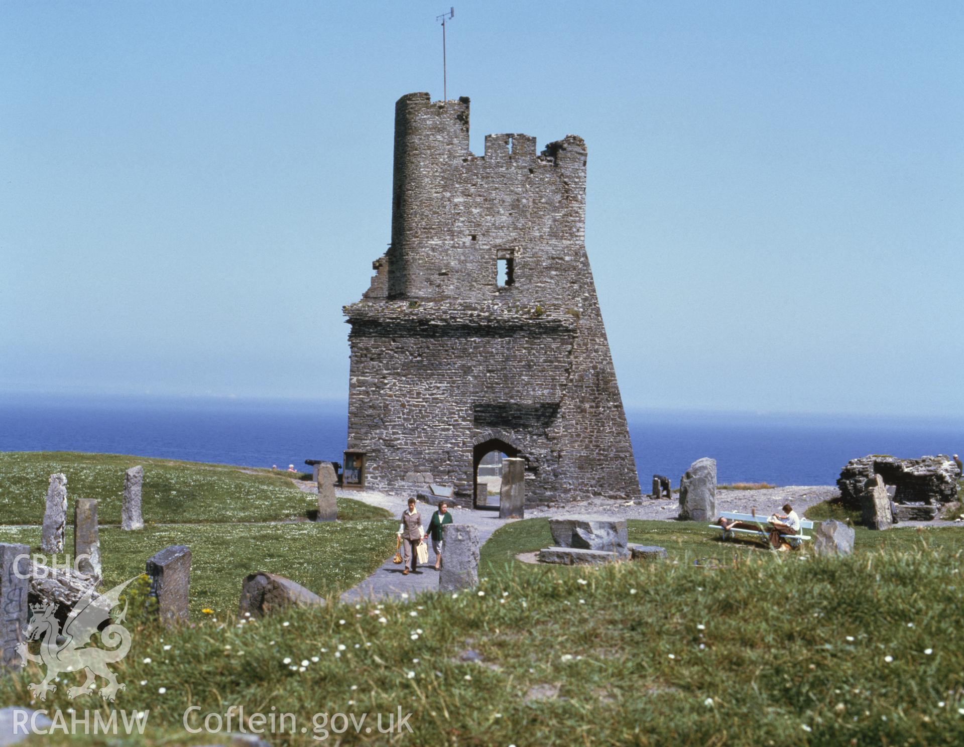 1 colour transparency showing view of Aberystwyth castle grounds with castle and sea in the background; collated by the former Central Office of Information.