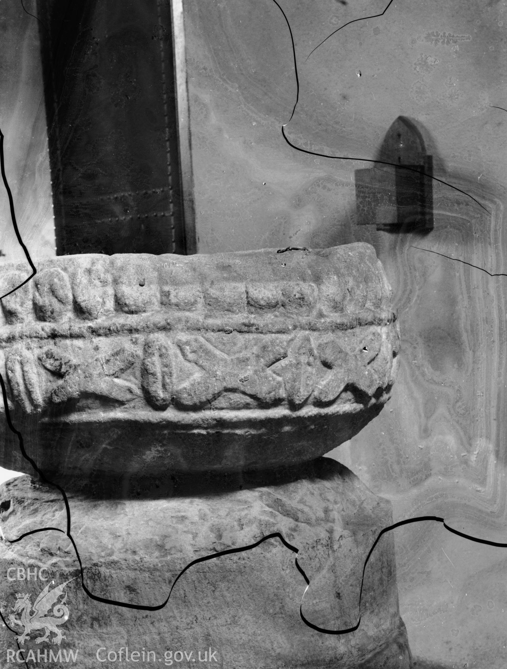 Black and white photo showing font at Dyfynnog Church.