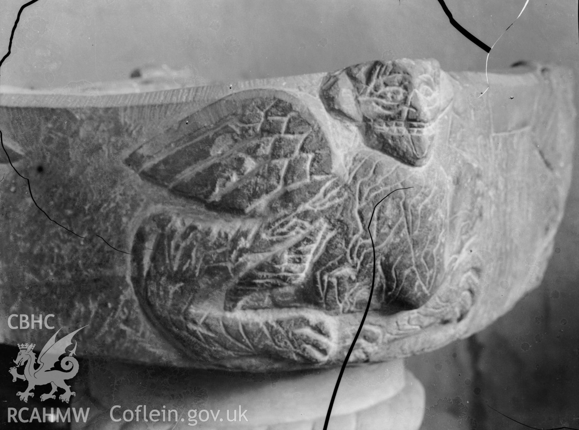 Black and white photo showing detail of the font at Llanarth Church.
