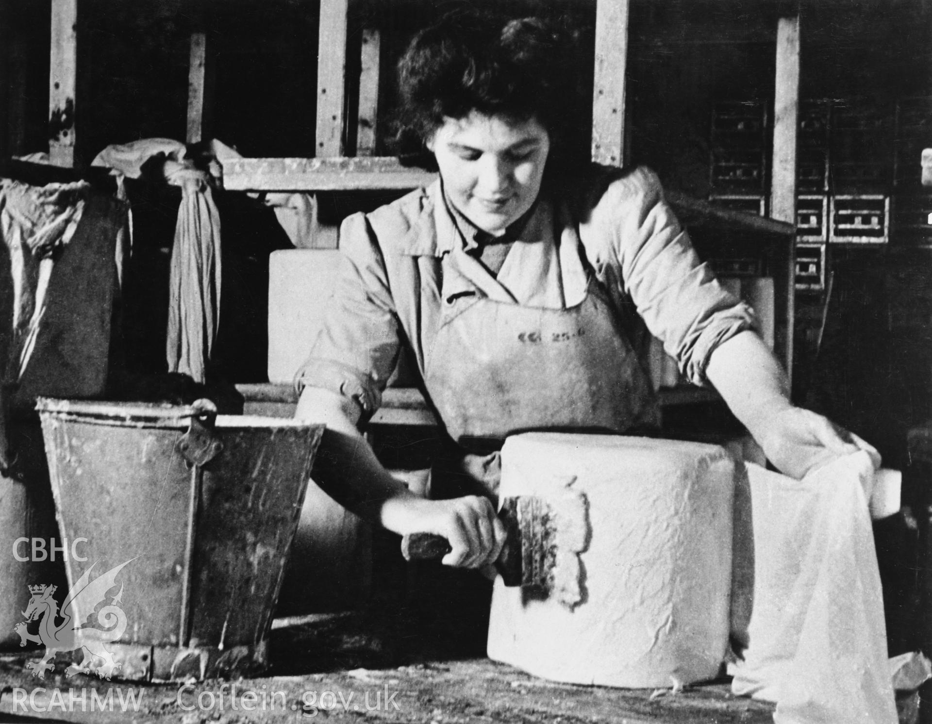 Copy of a pre-1950 photo showing stages of cheese production
