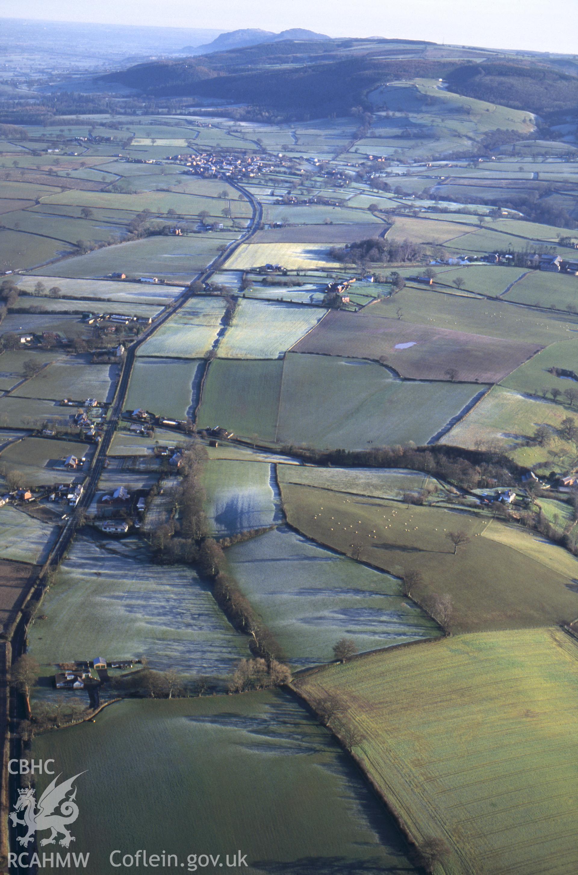 RCAHMW colour oblique aerial photograph of Offa's Dyke , Montgomery Area. Taken by C R Musson on 12/03/1995