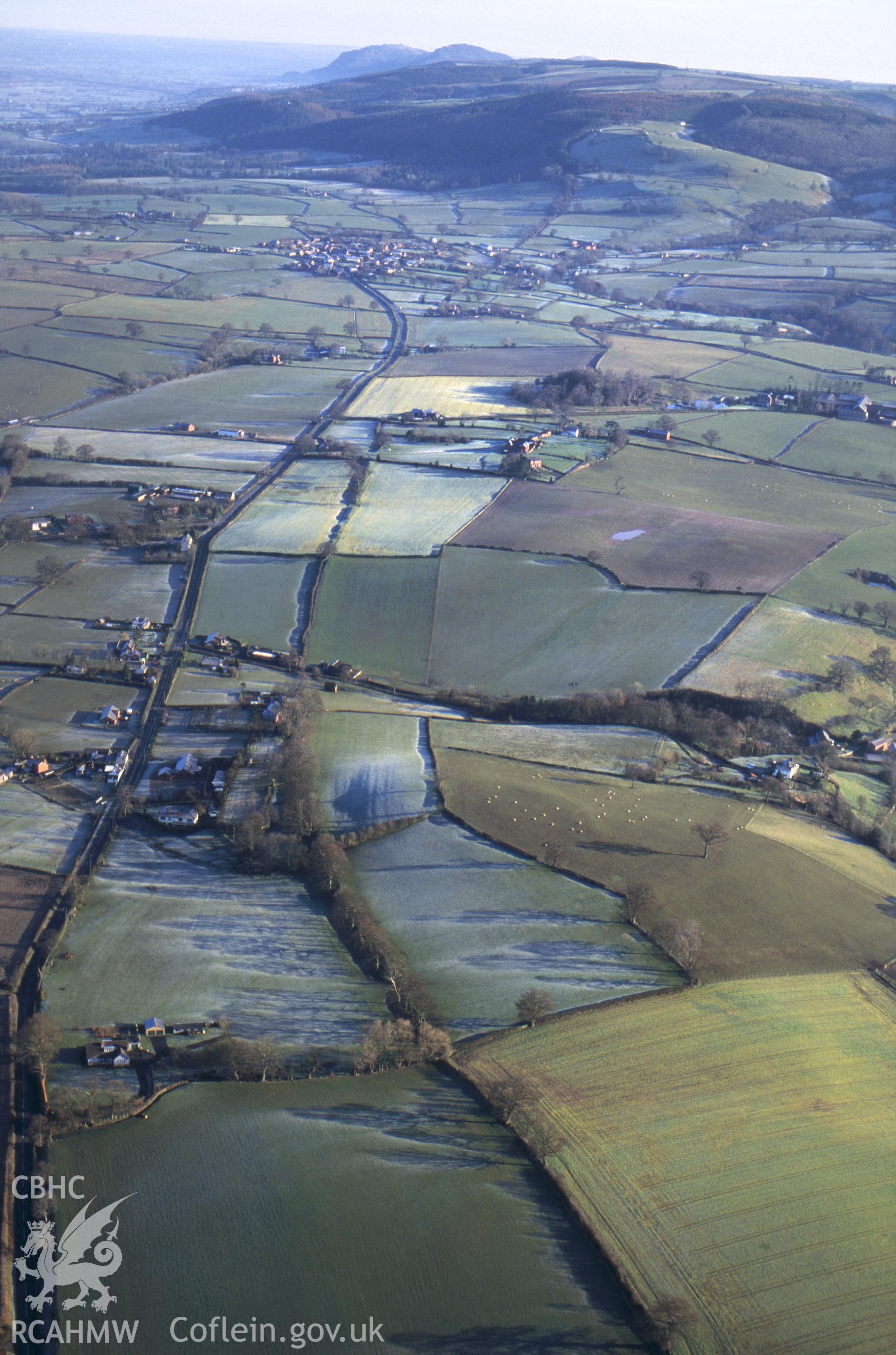 RCAHMW colour oblique aerial photograph of Offa's Dyke , Montgomery Area. Taken by C R Musson on 12/03/1995