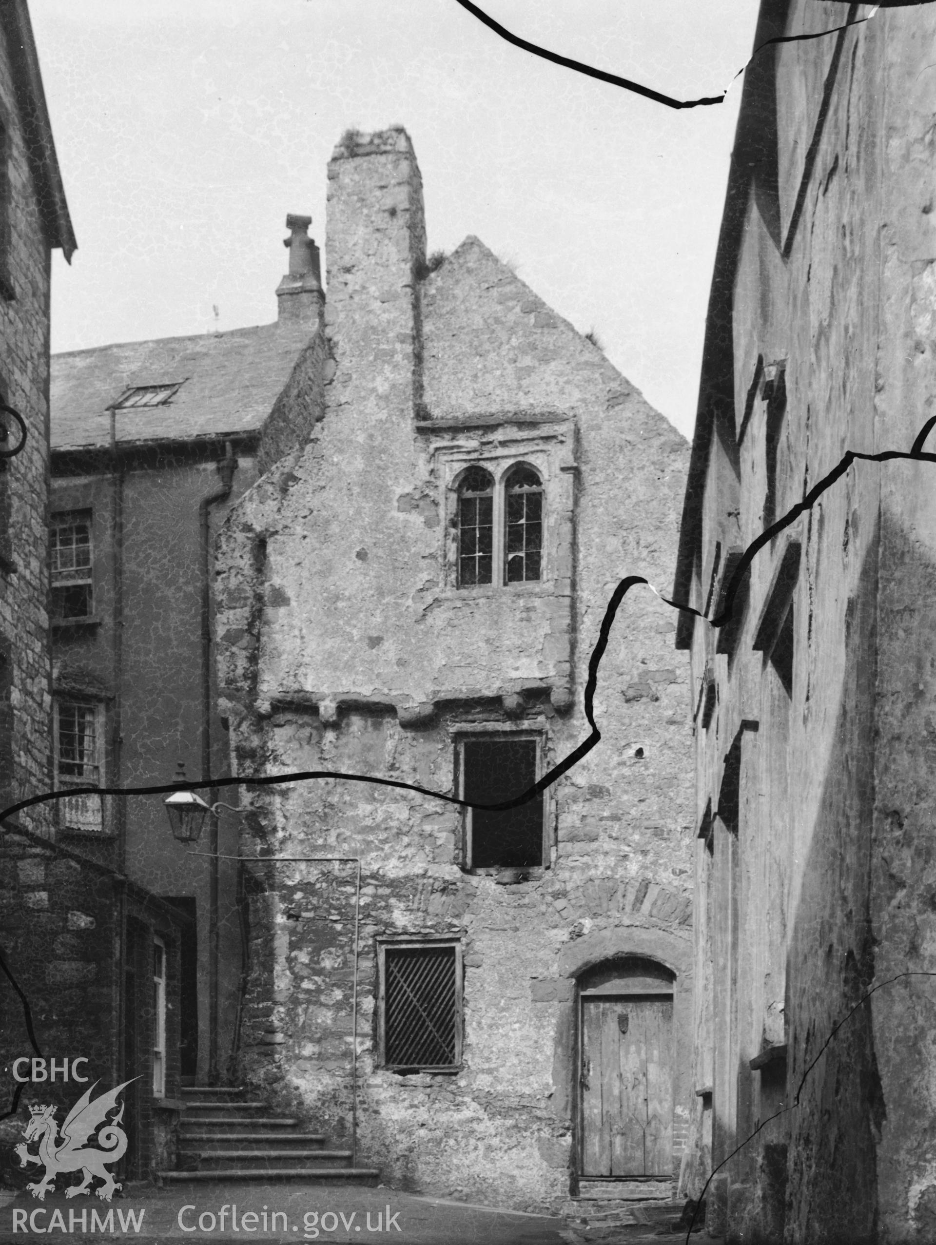 Black and white photo showing houses on Tenby Town Walls.