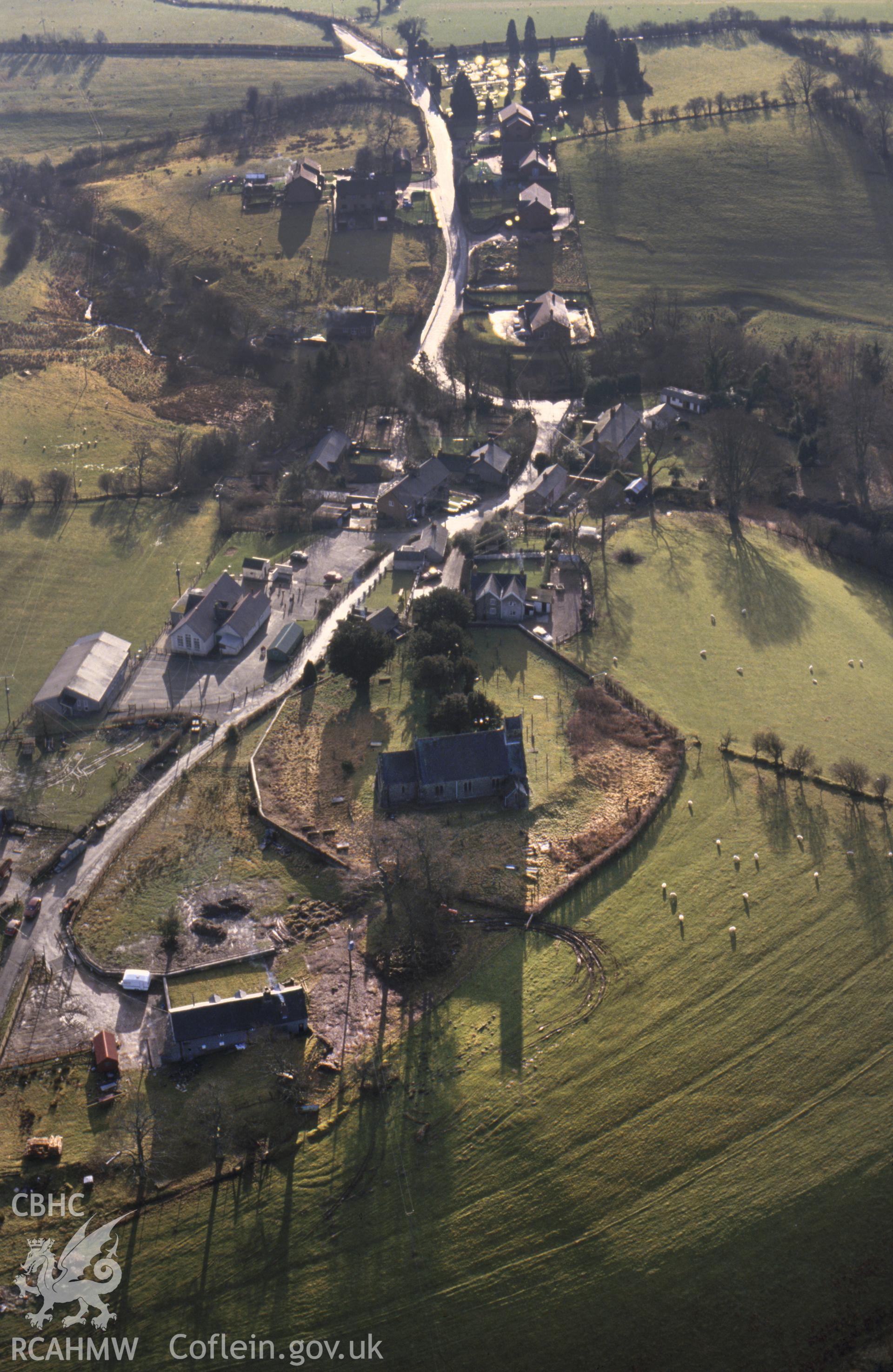 RCAHMW colour slide oblique aerial photograph of St Michael's Church, Llanfihangel, taken by C.R. Musson, 07/01/94