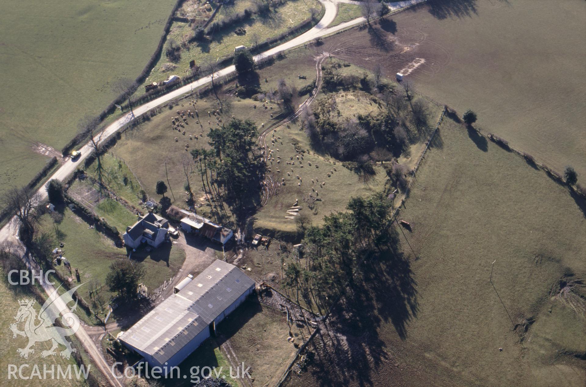 RCAHMW colour oblique aerial photograph of Bishop's Moat taken on 13/03/1995 by C.R. Musson