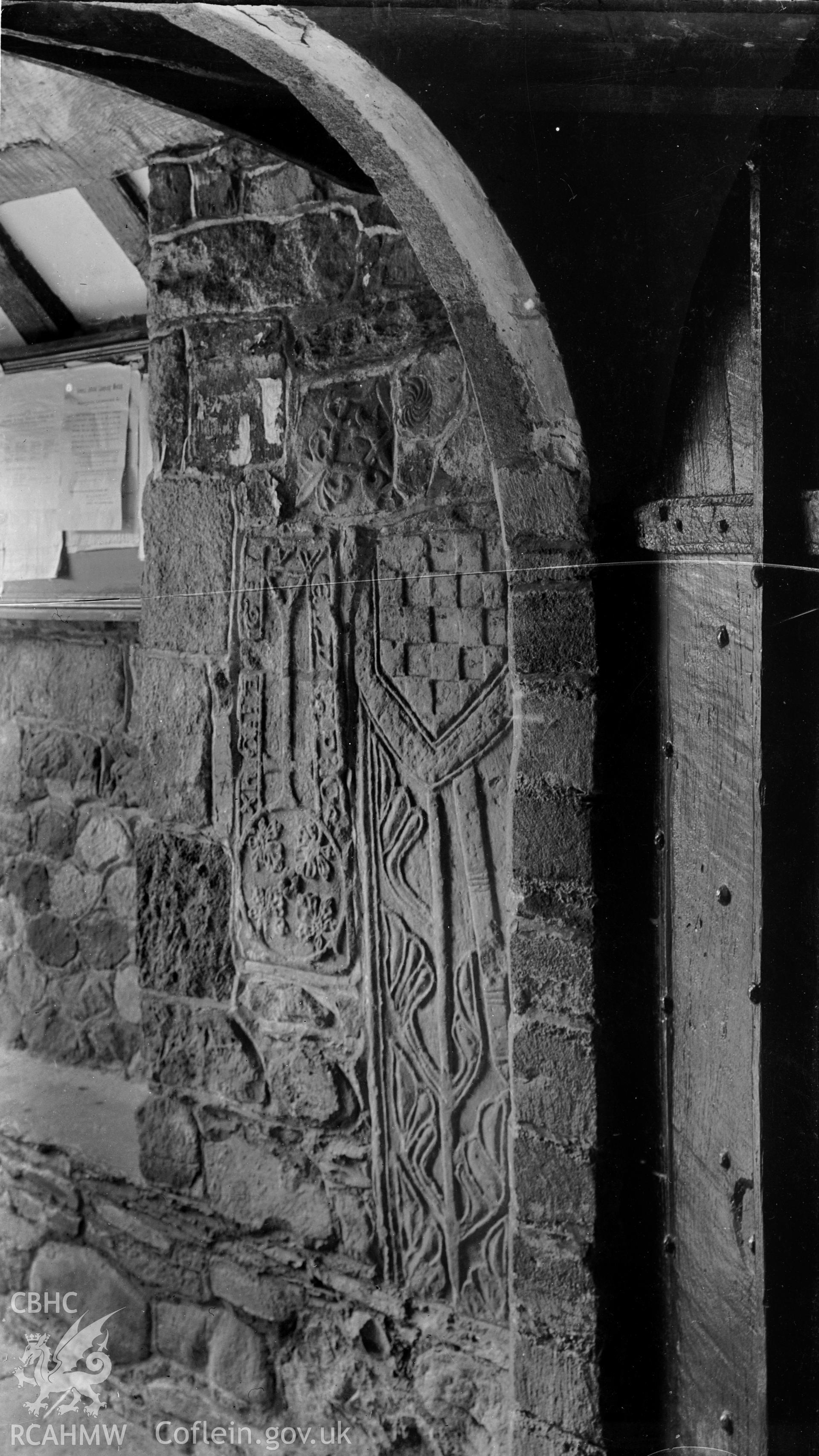 Interior: detail of doorway and inscribed stone.