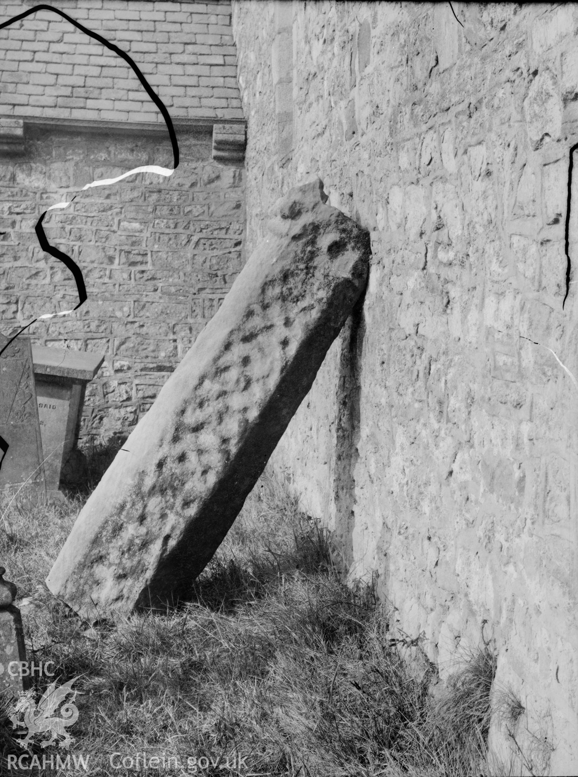 Black and white photo showing inscribed stone at Coychurch.
