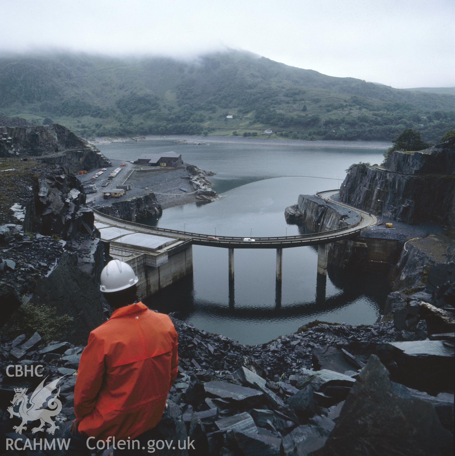 1 colour transparency showing lake and circular road at Dinorwig Power Station; collated by the former Central Office of Information.