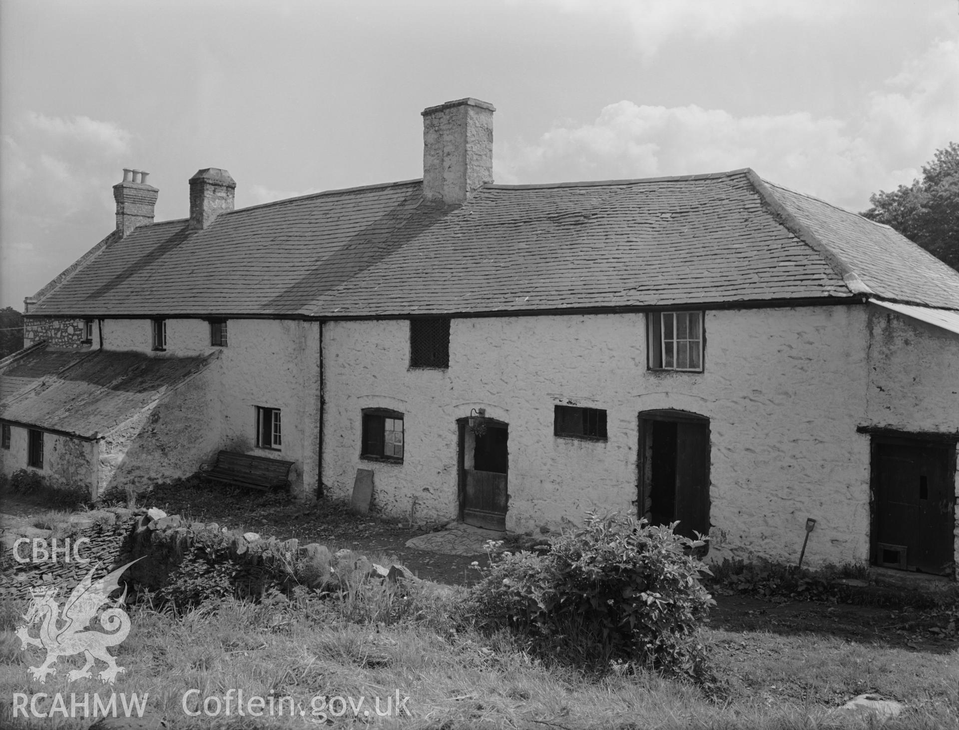 A view of the original house that became the stables. Long L-Shaped house, with a stone lean to.