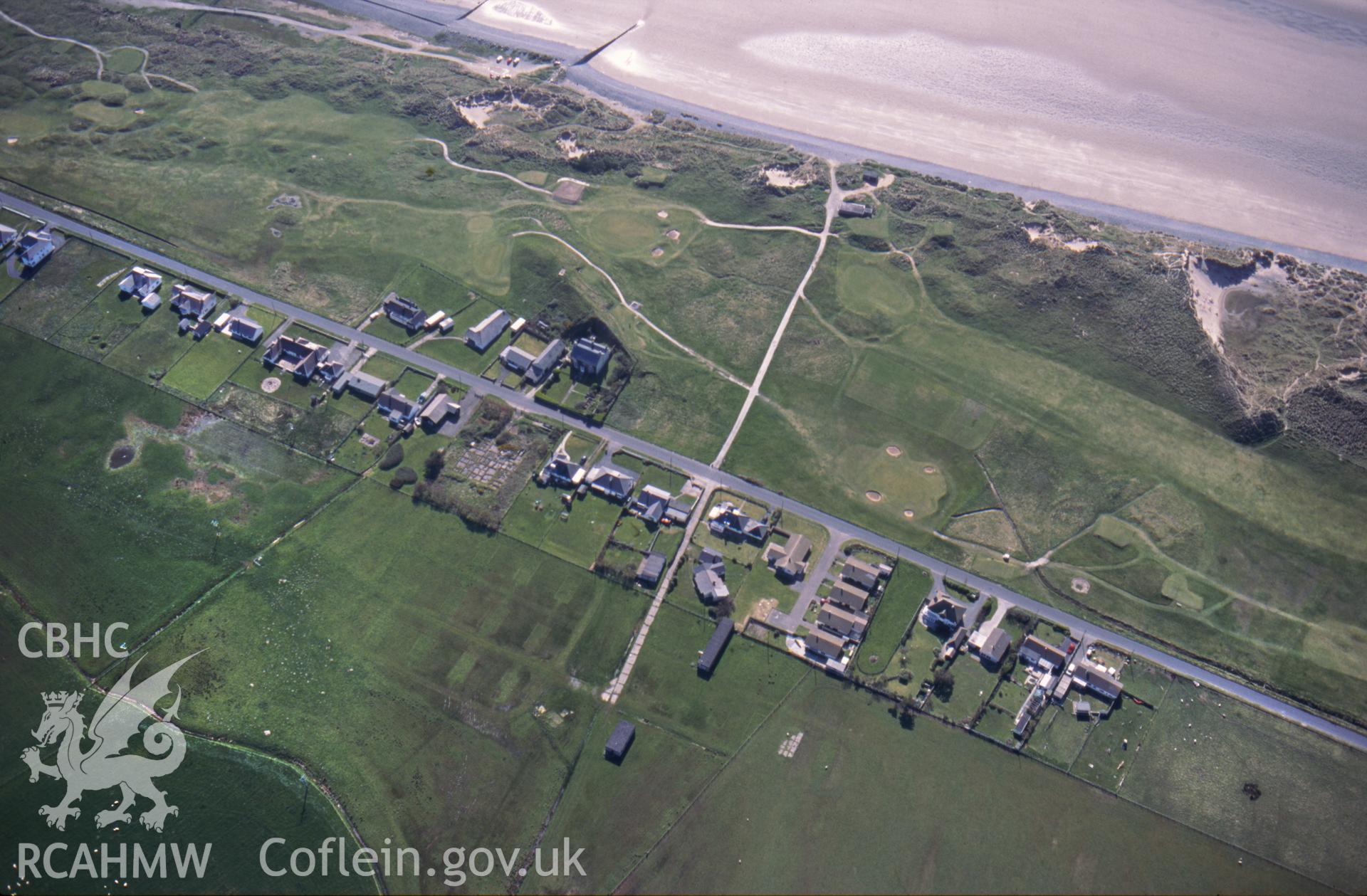 RCAHMW colour slide oblique aerial photograph of old barrack blocks at Ynys Tachwedd, Borth, taken on 29/04/1999 by Toby Driver