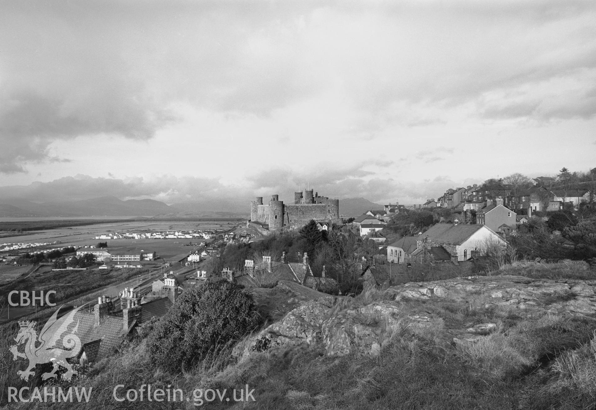 Photographic negative showing view of Harlech, including the castle; collated by the former Central Office of Information.