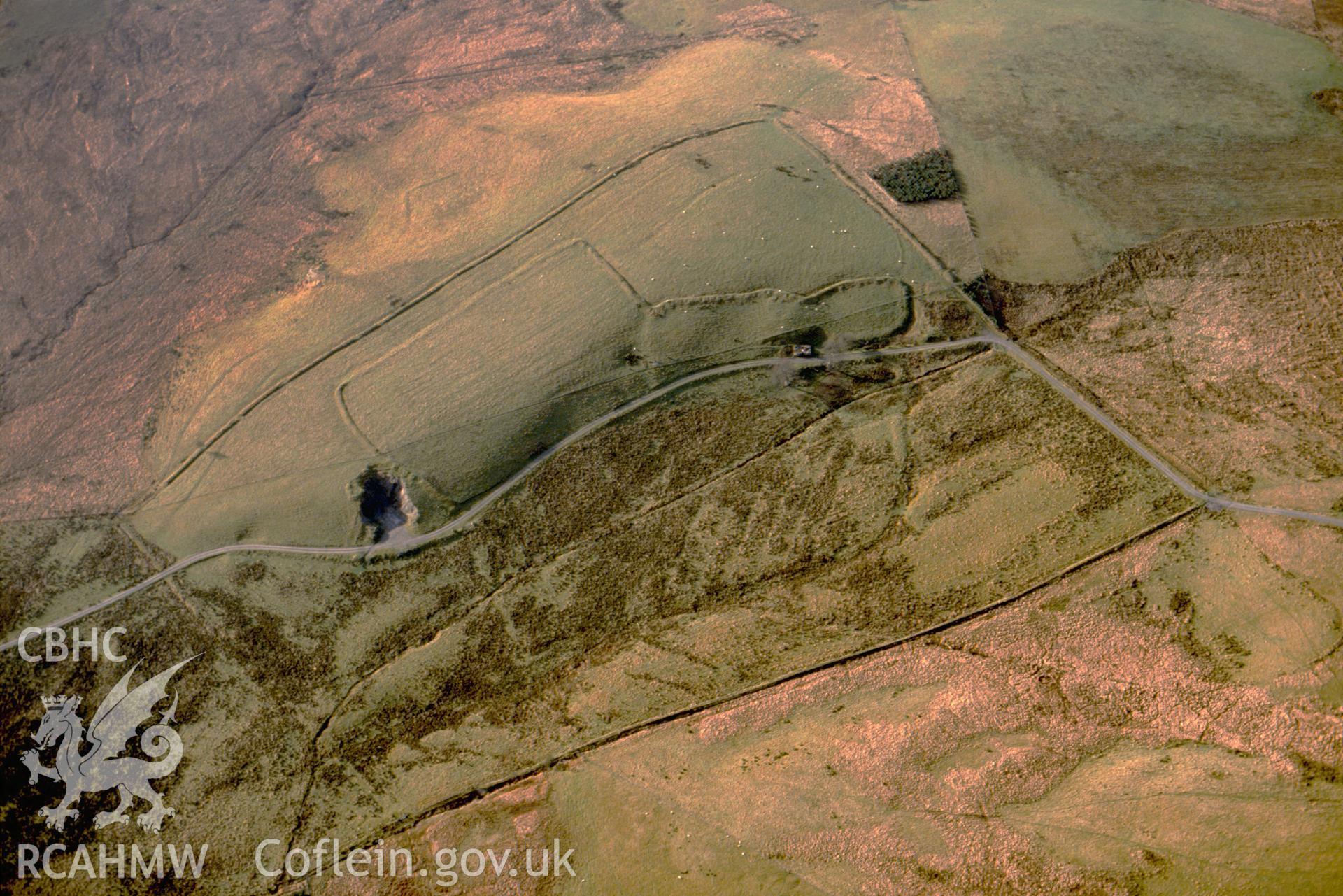 RCAHMW colour slide oblique aerial photograph of a rectilinear enclosure at Rhiwlas, Cmy Y Saeson, Llangurig, taken on 08/12/1992 by CR Musson