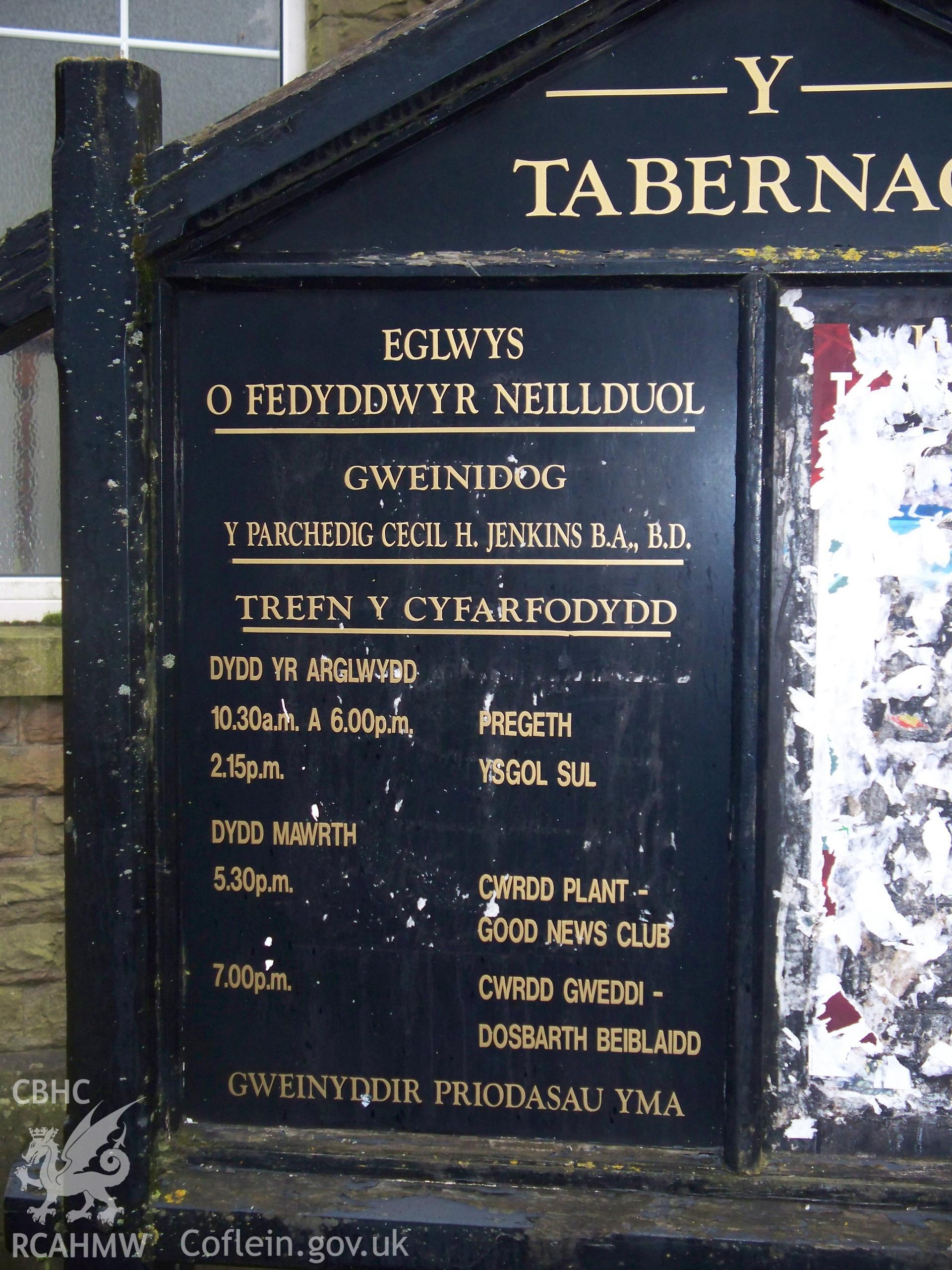 Detail of order of service board on NE.