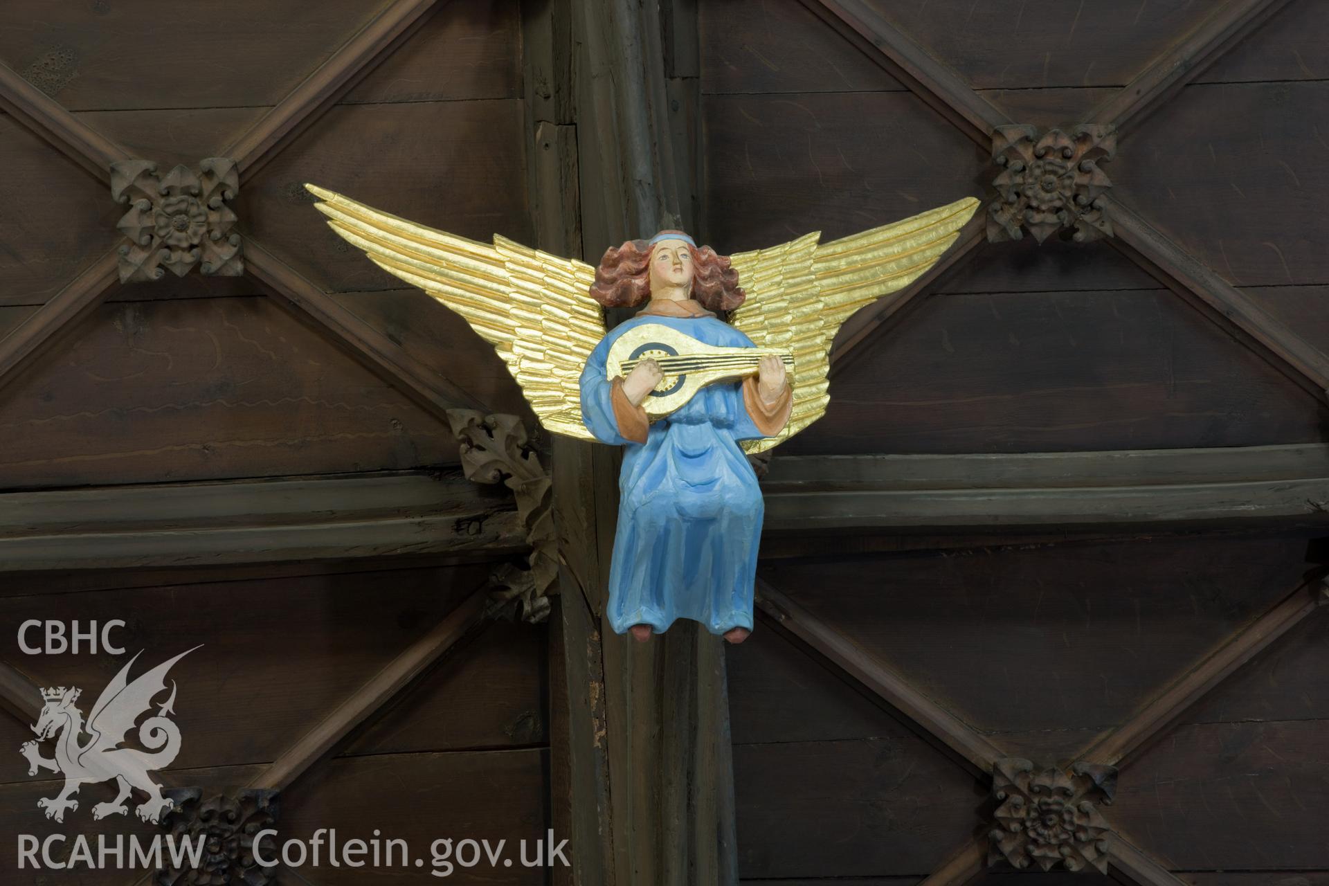 Carved angel ceiling decoration.