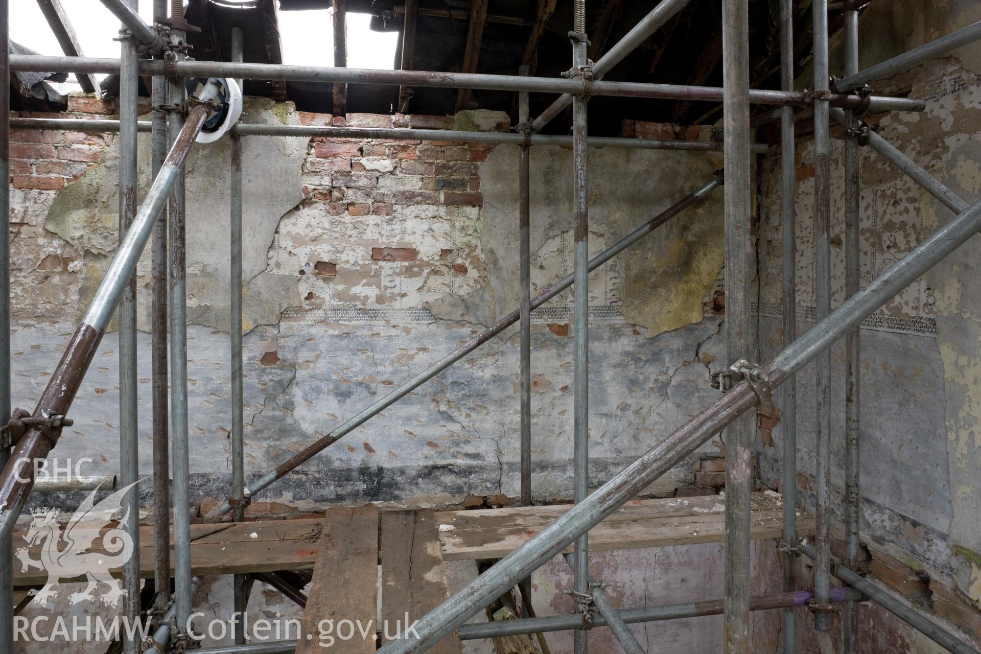 Interior west wall of first floor central bay.