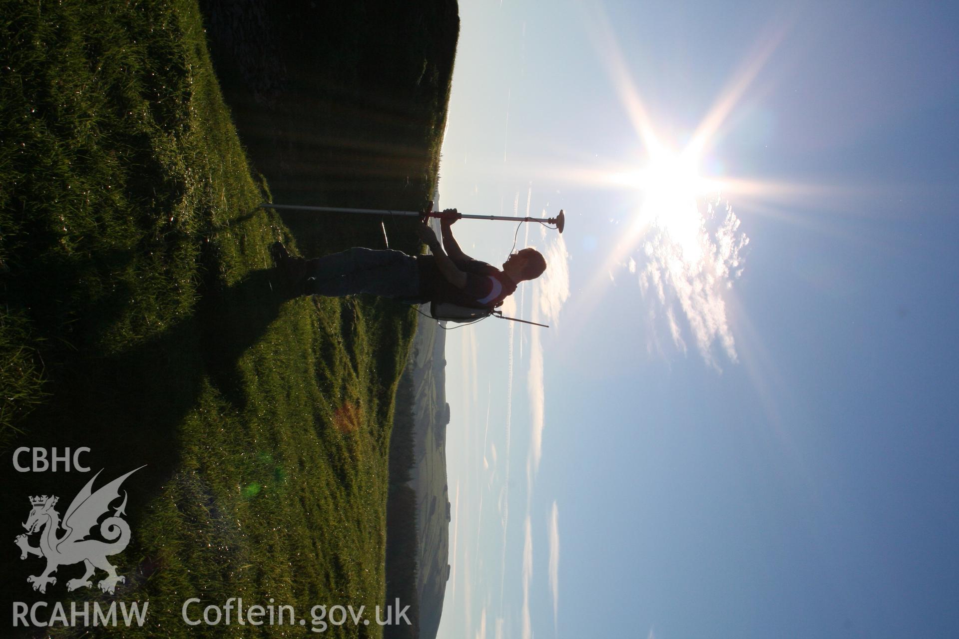 Pen'r-allt hillfort. Toby Driver surveying with GPS.