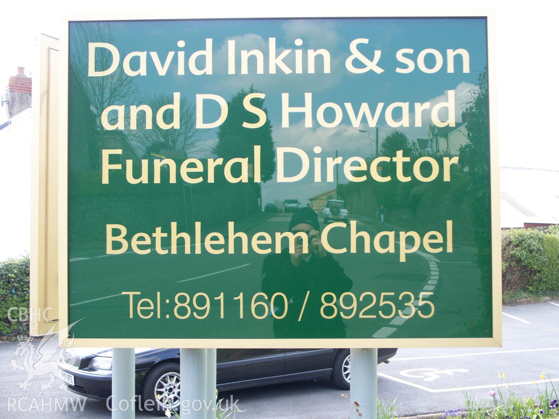 Funeral director?s sign outside SE front.