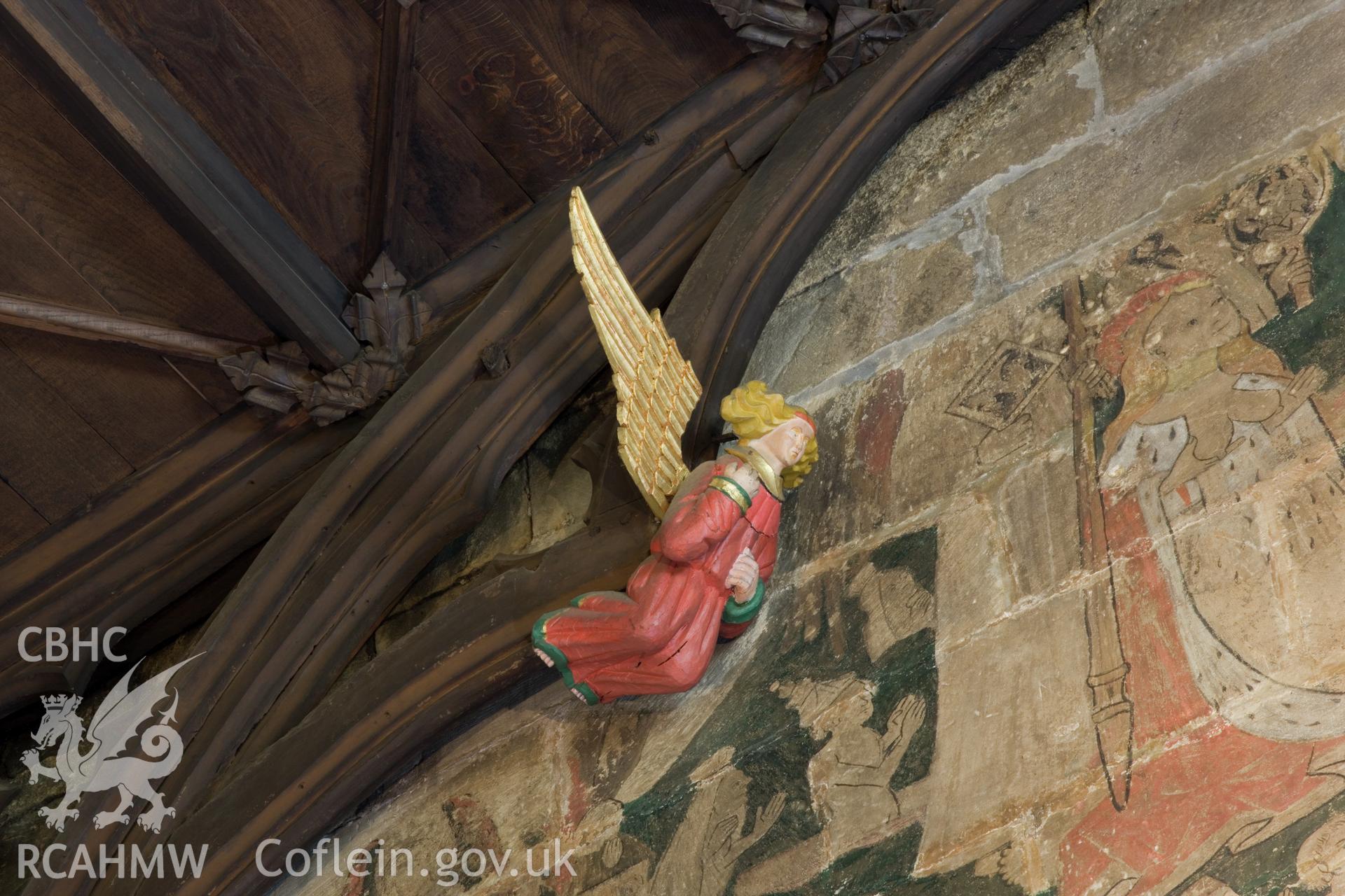 Carved angel ceiling decoration and Doom.