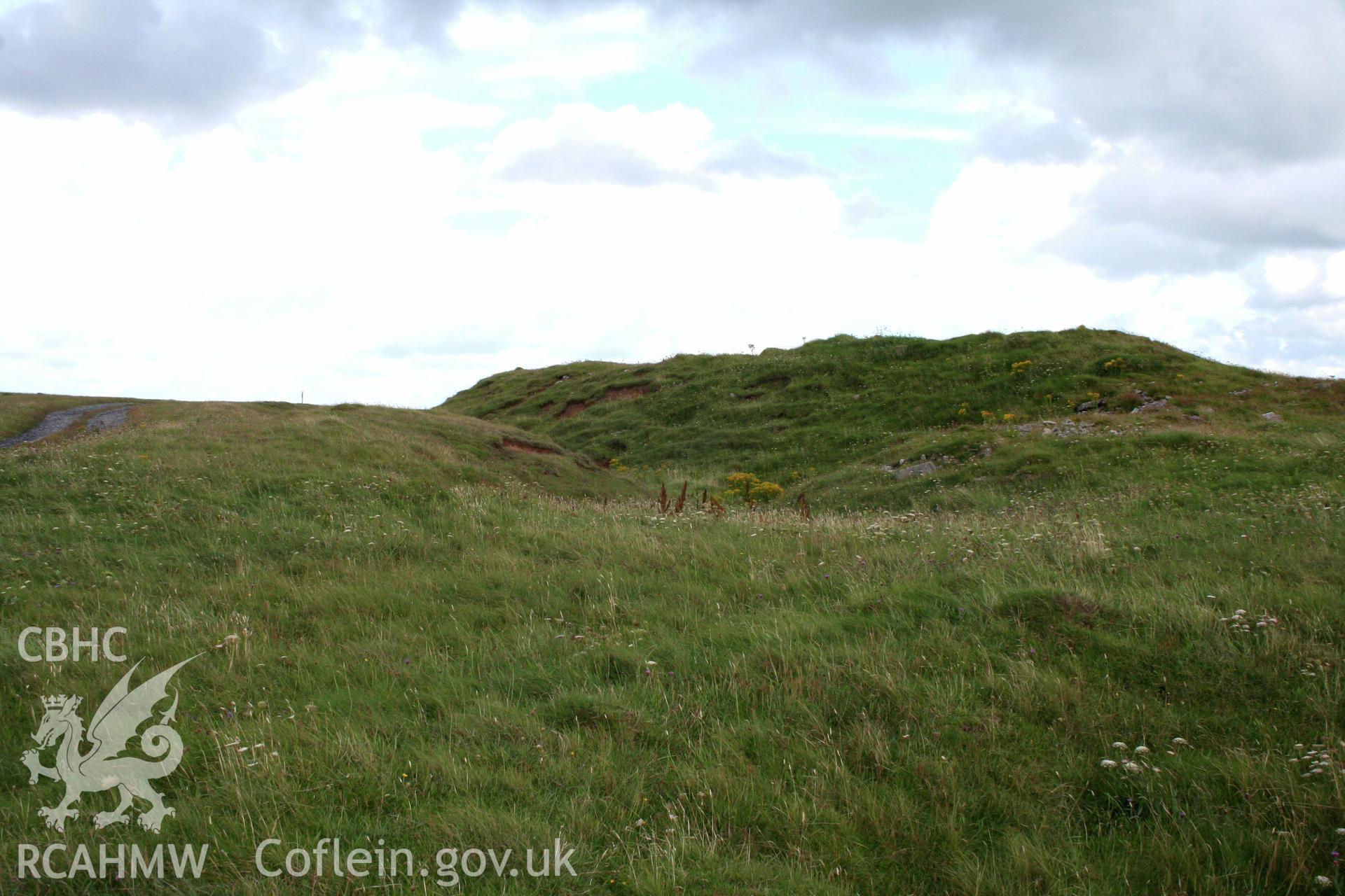 Looking south-east to the section of ditch defining the entrance forecourt to the fort.