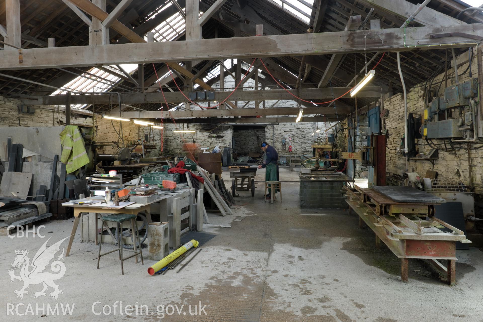 General view of main work area, hand finishing of slab in progress.