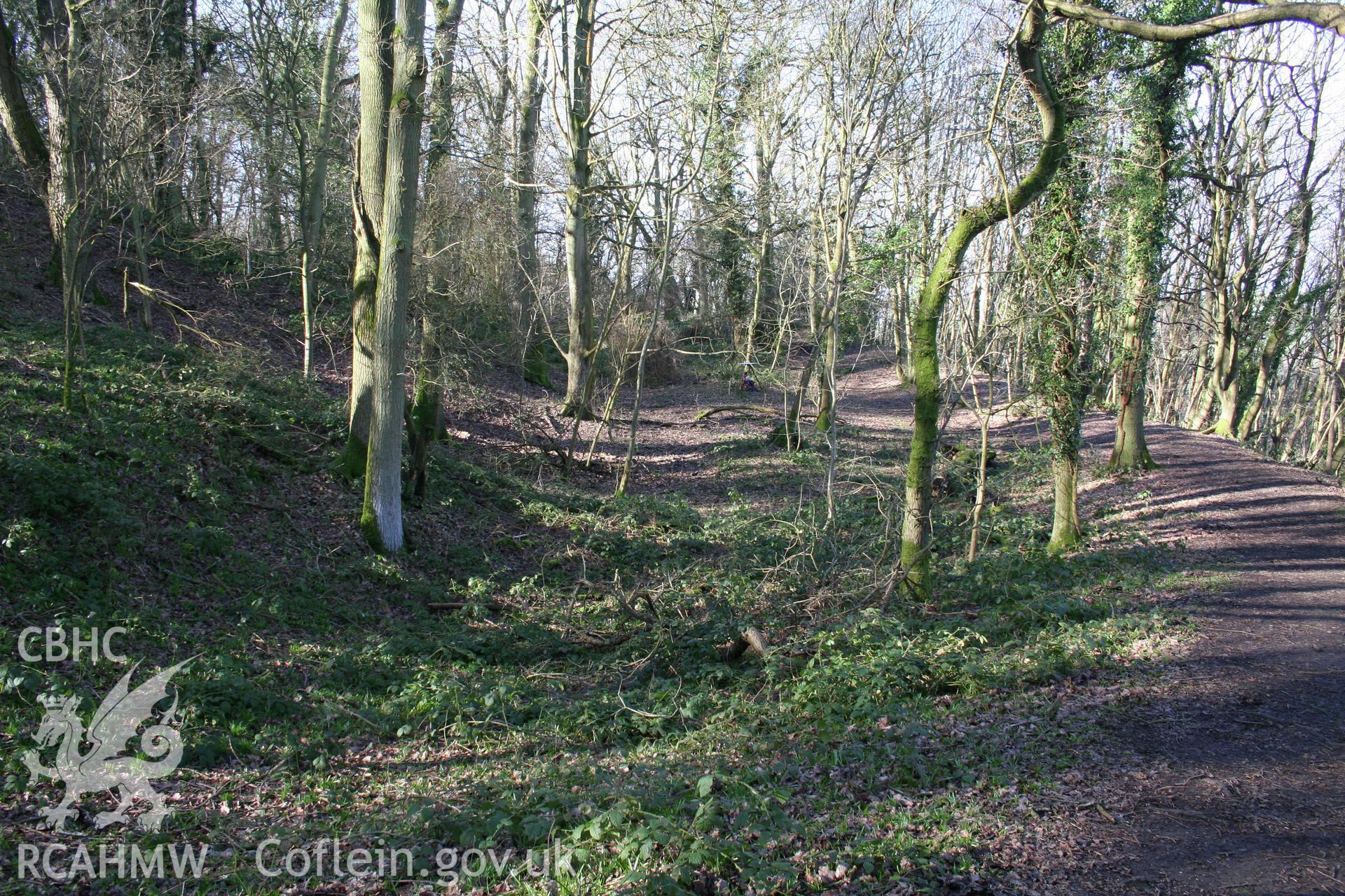 Gaer Fawr Hillfort.  Looking west along the outer ditch of the original summit fort with the later phase hillfort rampart on the right.