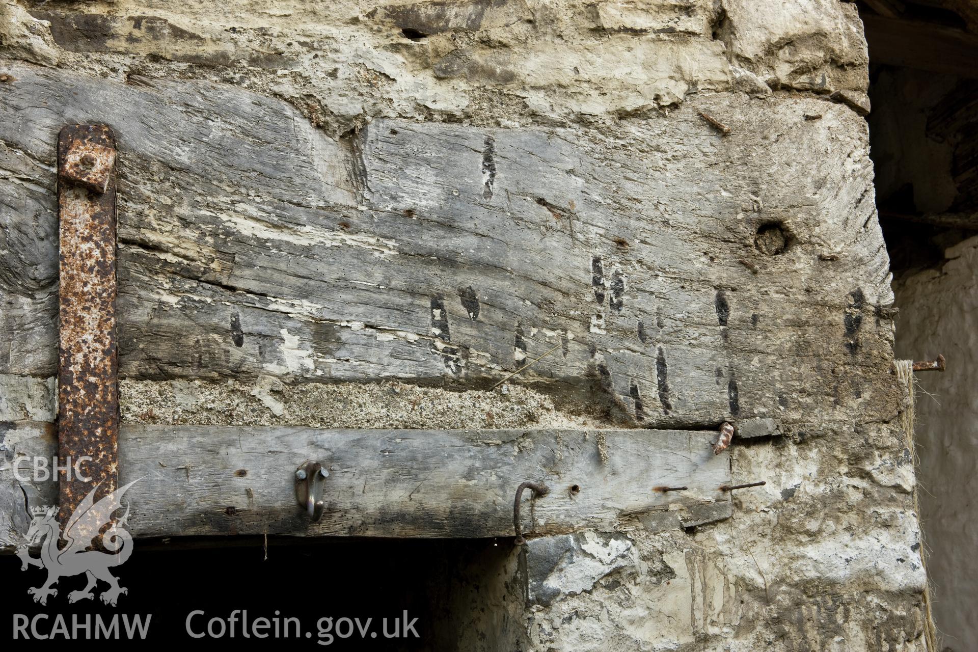 Detail of carved stop on fireplace.