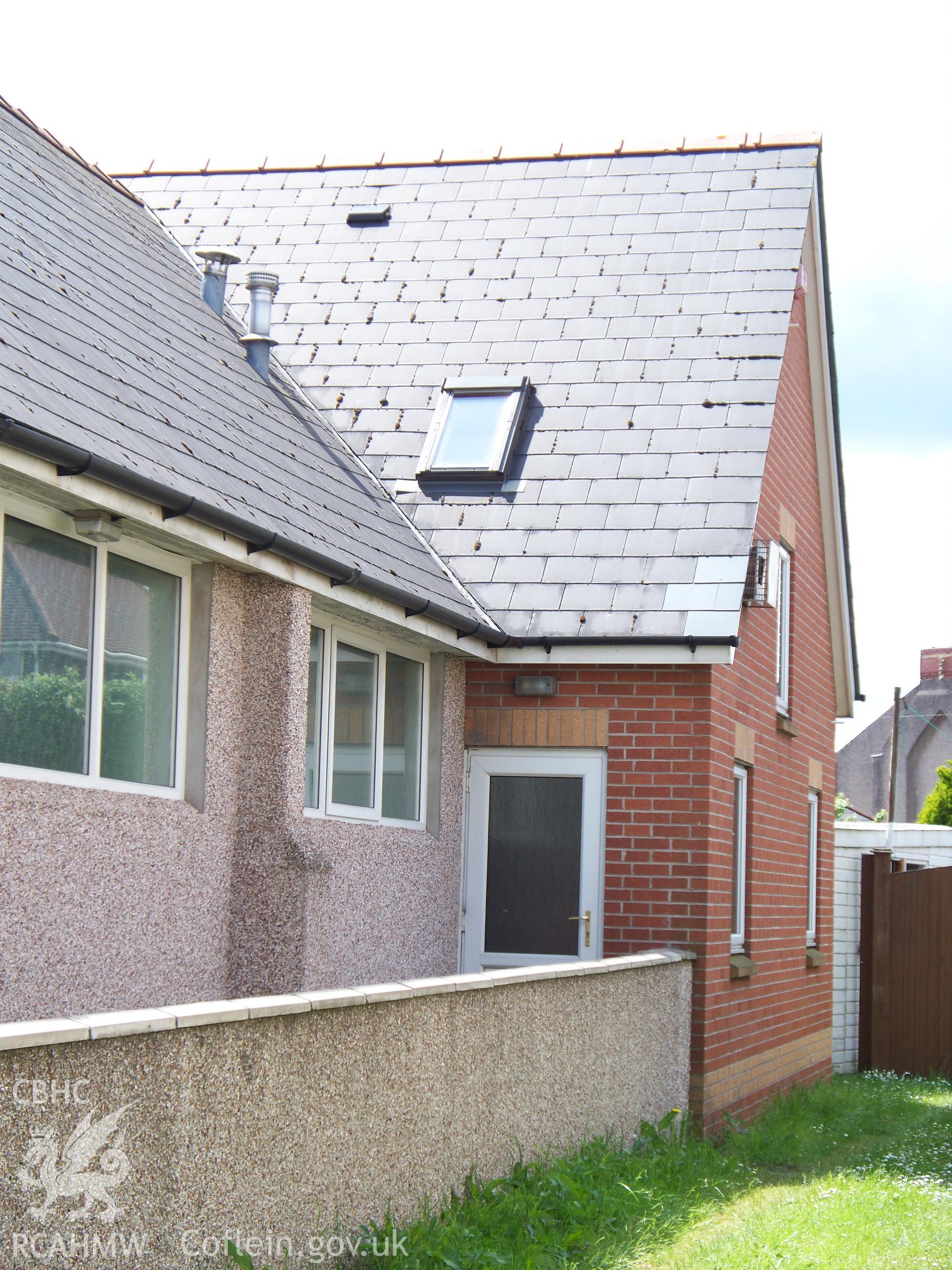 Rear north-side with modern west rear extension.