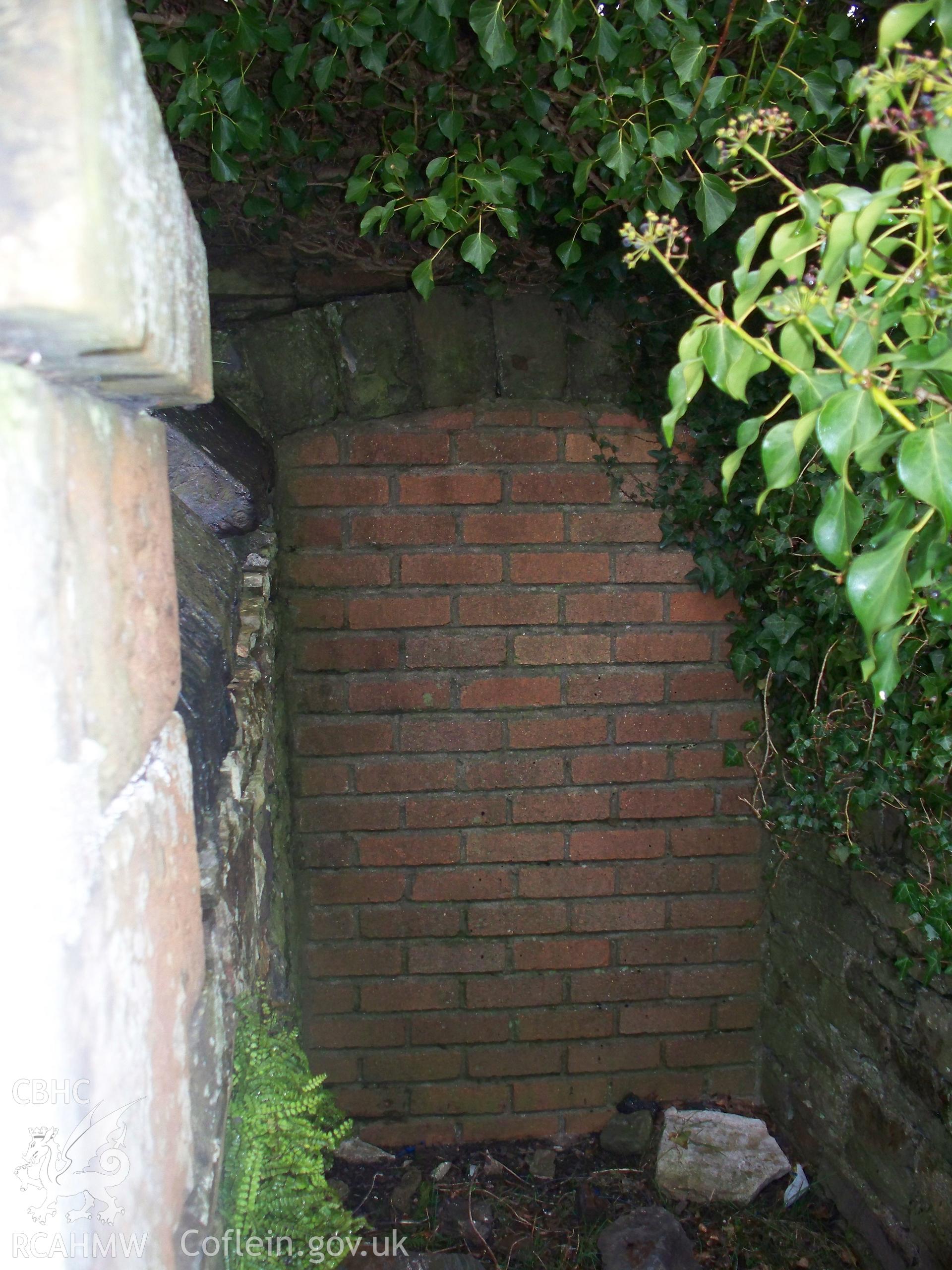 Entrance to burial vault on north side of west chapel front.