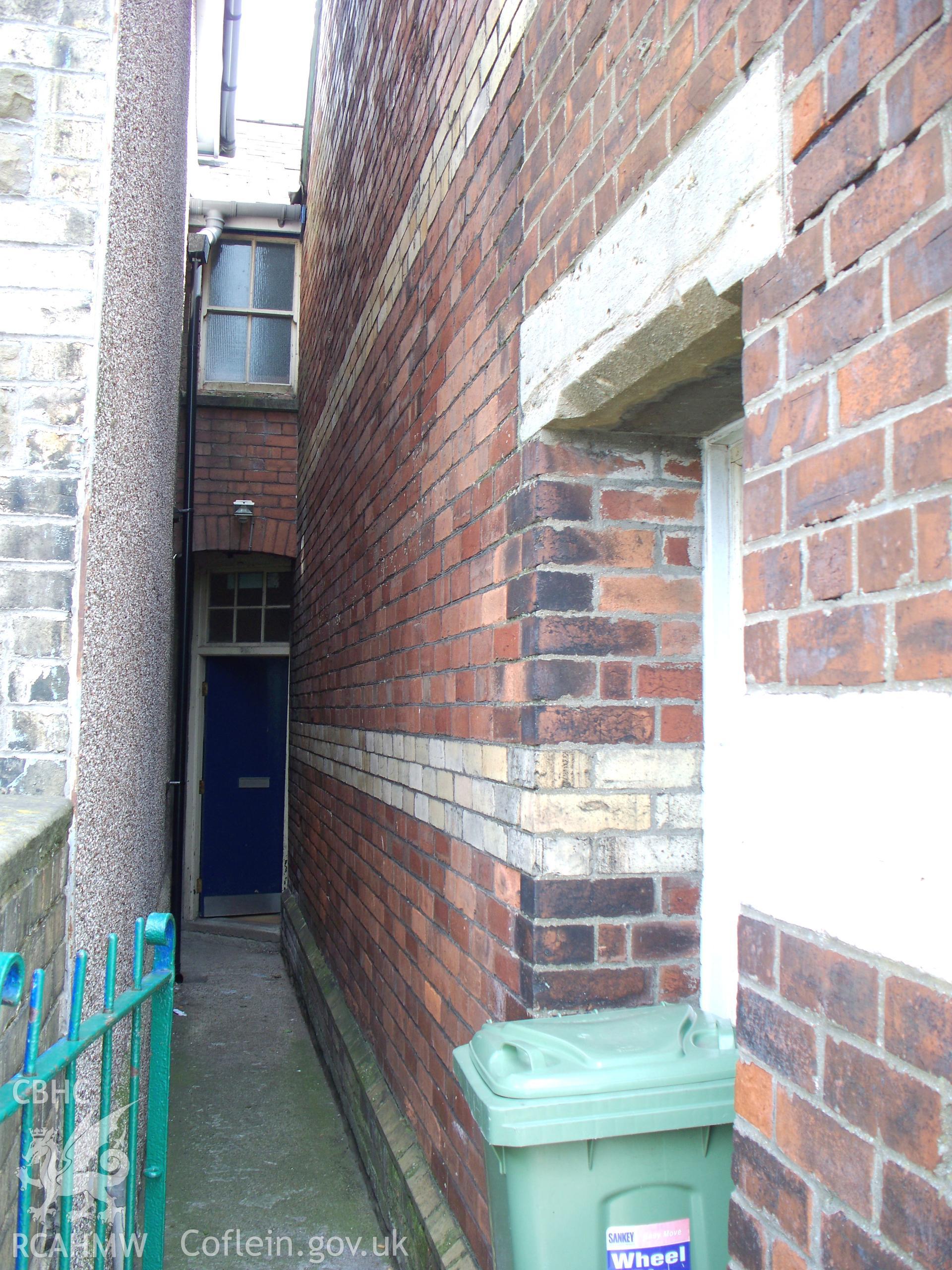 Entry at NE rear of chapel with Sunday School entrance.