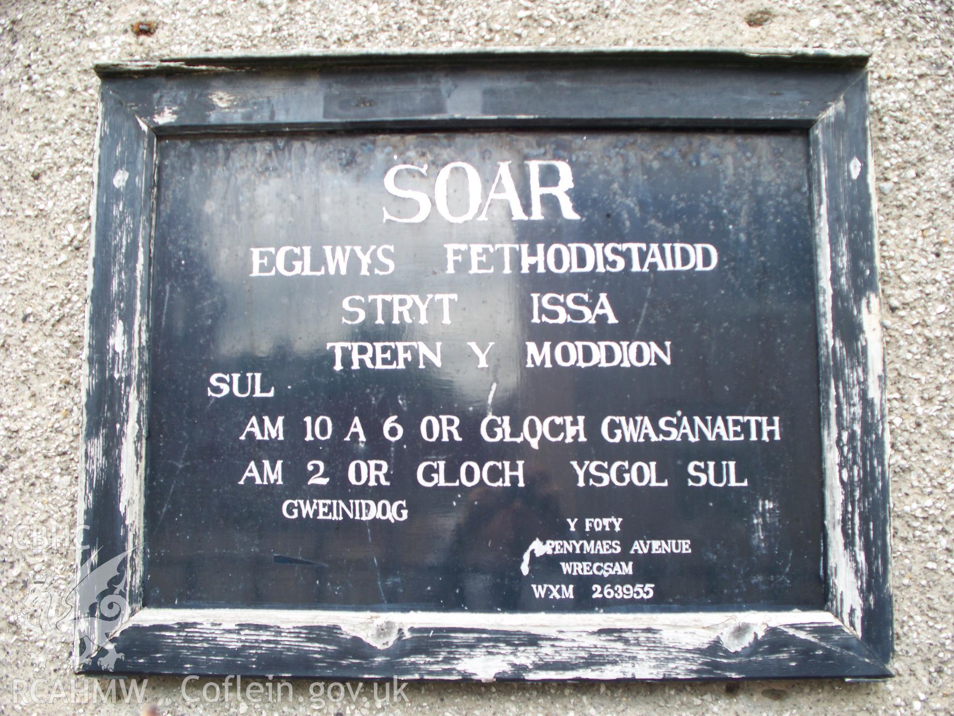 Order of services board on south front.