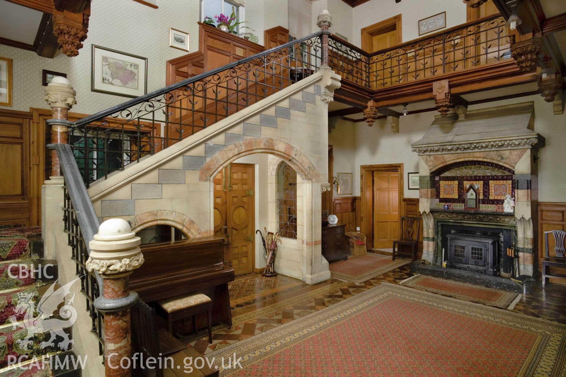 Interior, entrance hall looking towards fireplace.