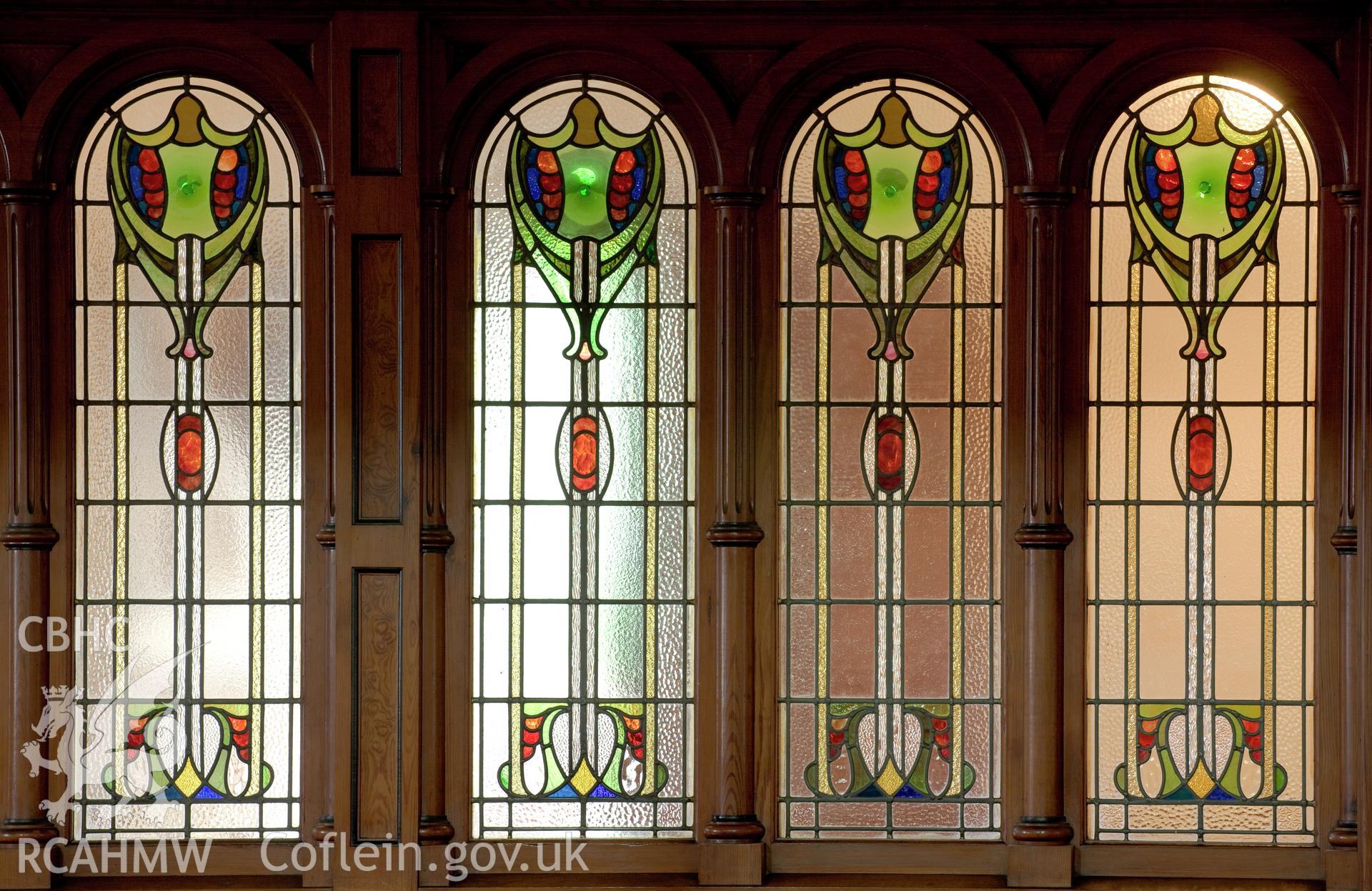 Detail of stained glass below gallery.