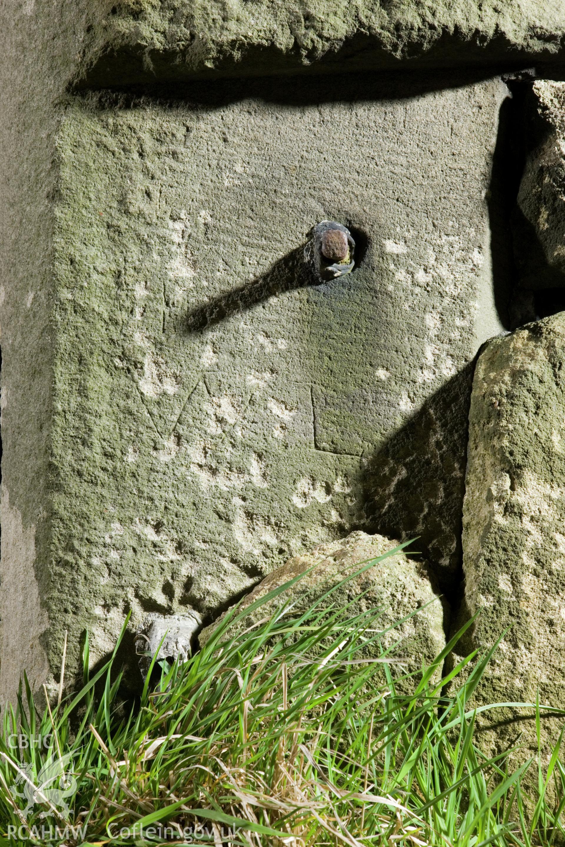 Reworked column, with initials and iron pin by socket entry.