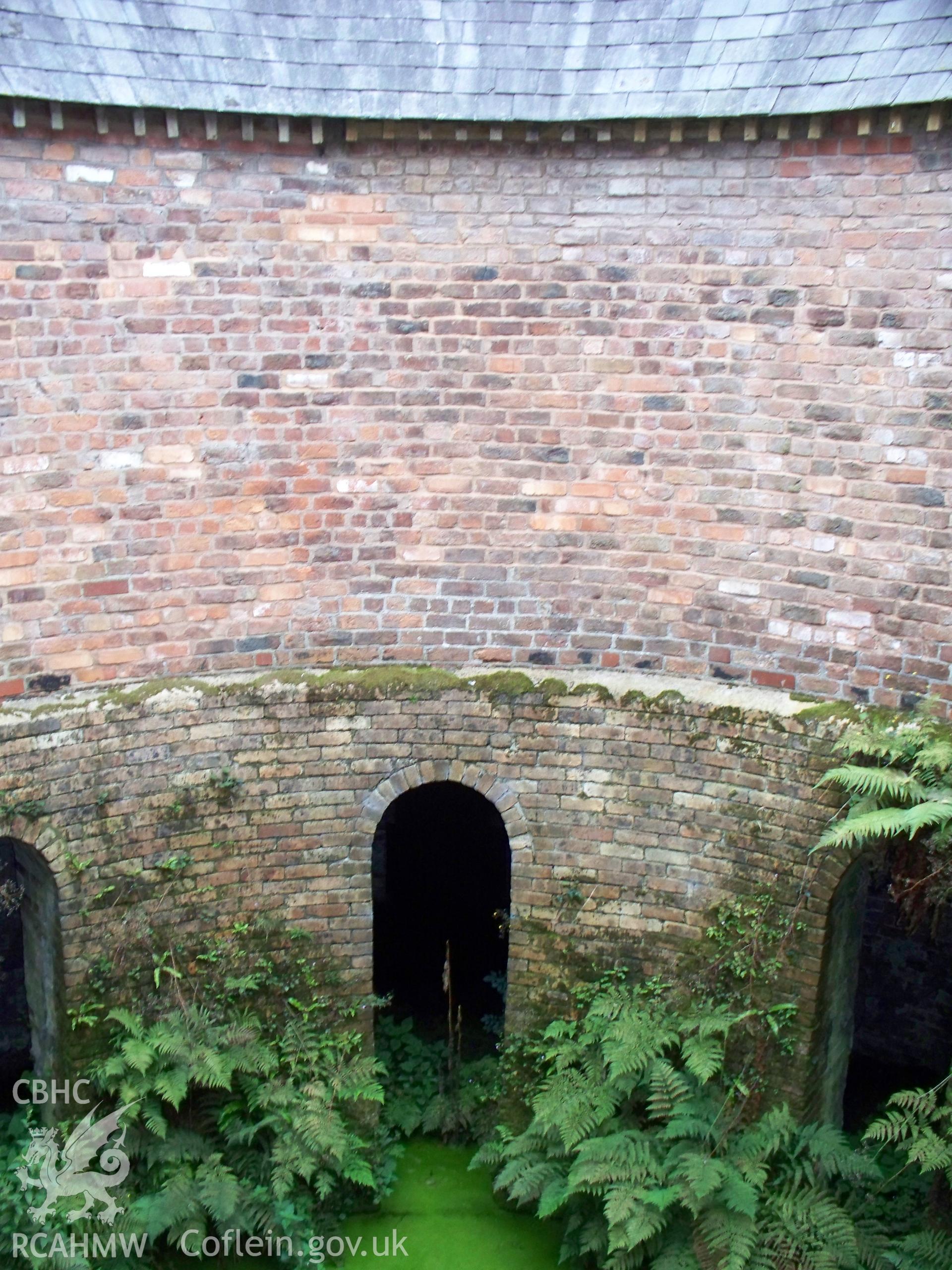 Looking east showing full height from slurry basement to roof of circular house.