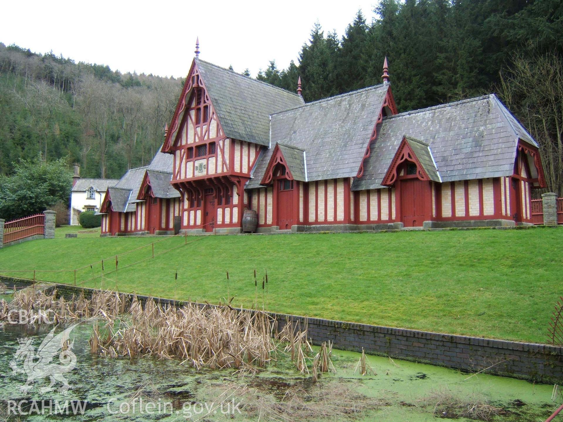 Central gabled range of the north-west side of the poultry house with the pond in front & access ramp.