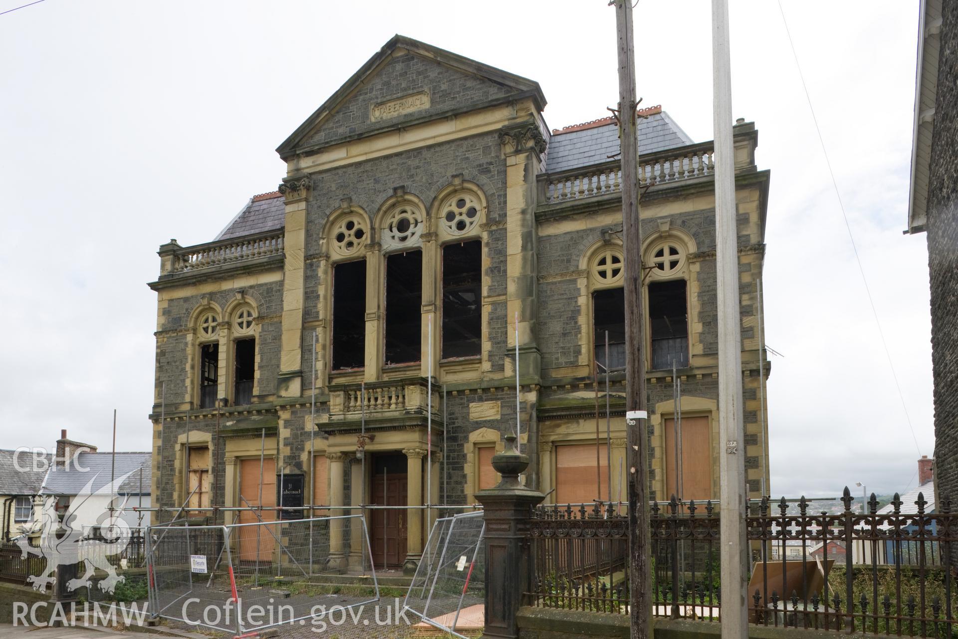 Damaged facade from northwest, prior to demolition.