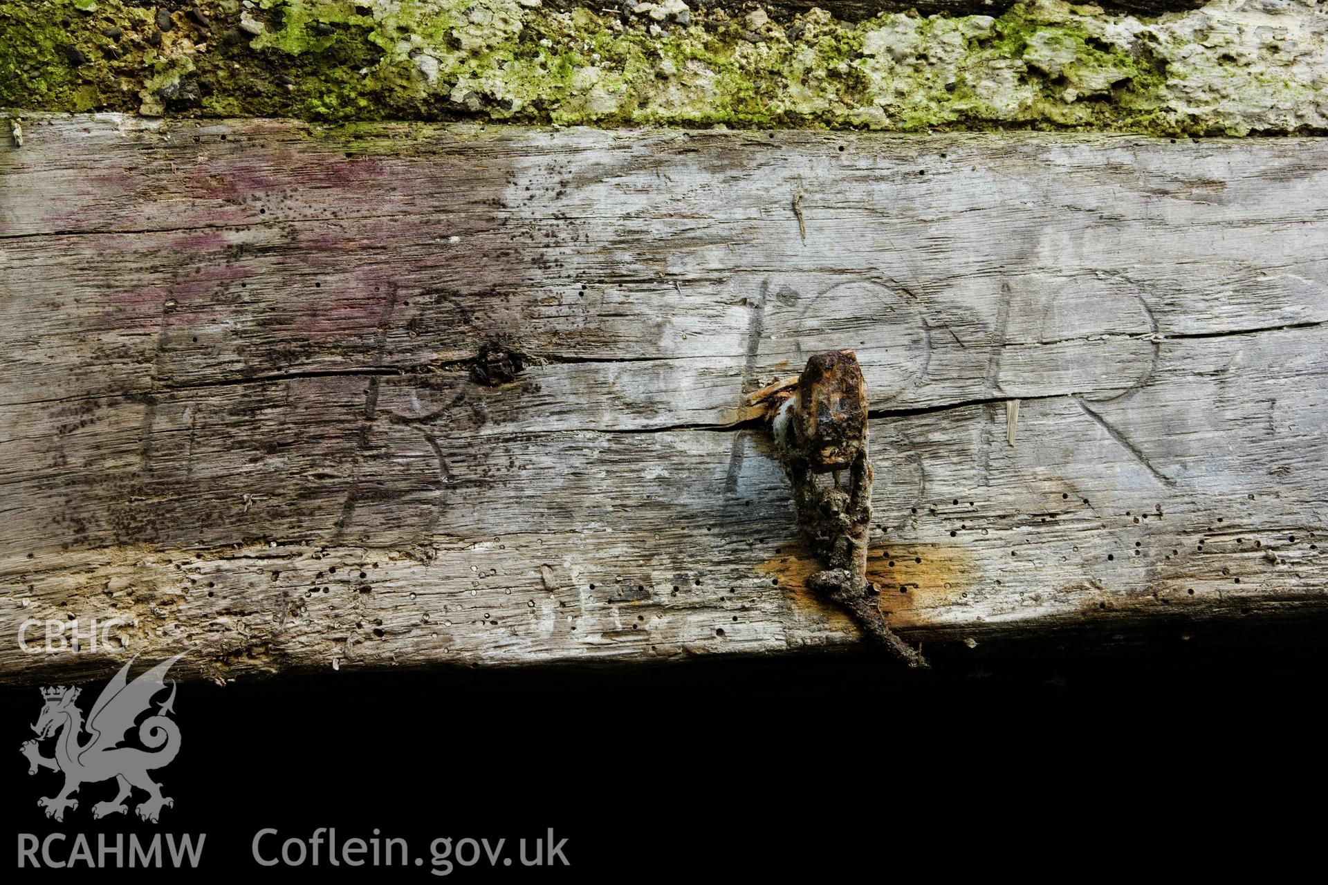 Date and letters inscribed on fireplace beam.