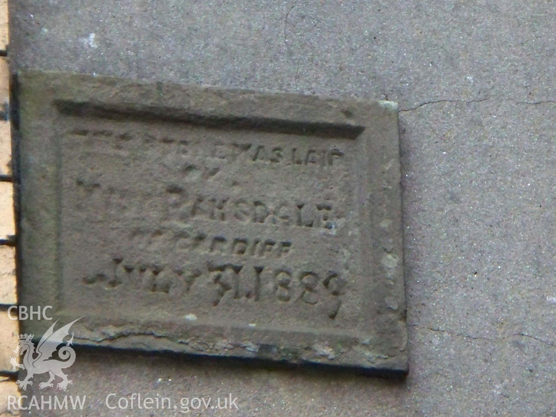 2nd. Re-set 1889 plaque near the NE door.