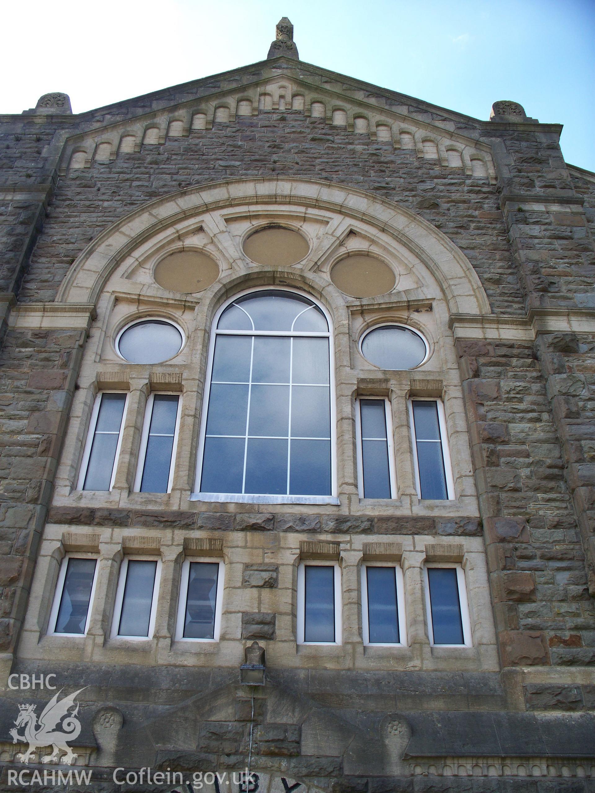 Main traceried window above SE door.