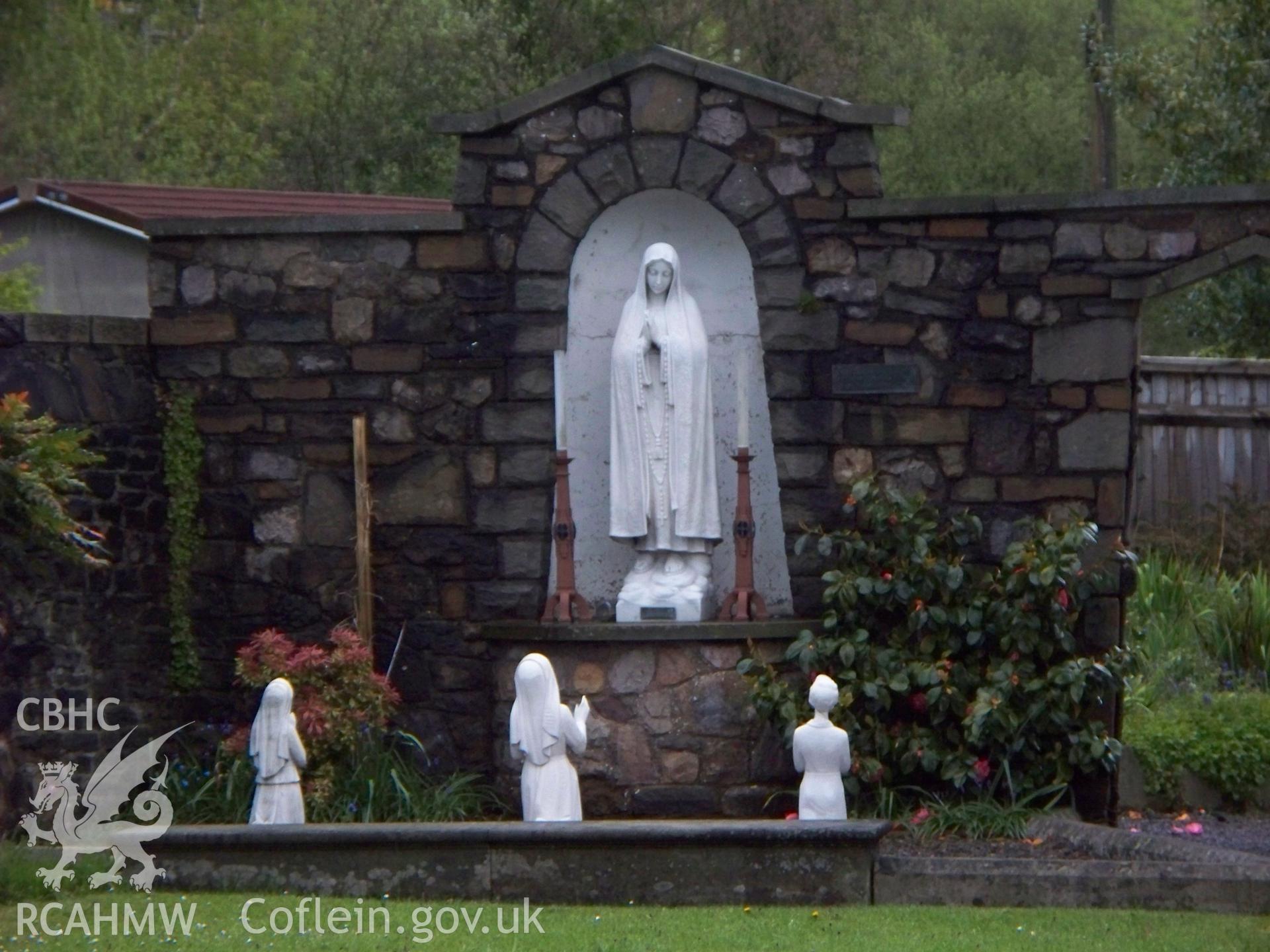 Shrine to north-east of church.
