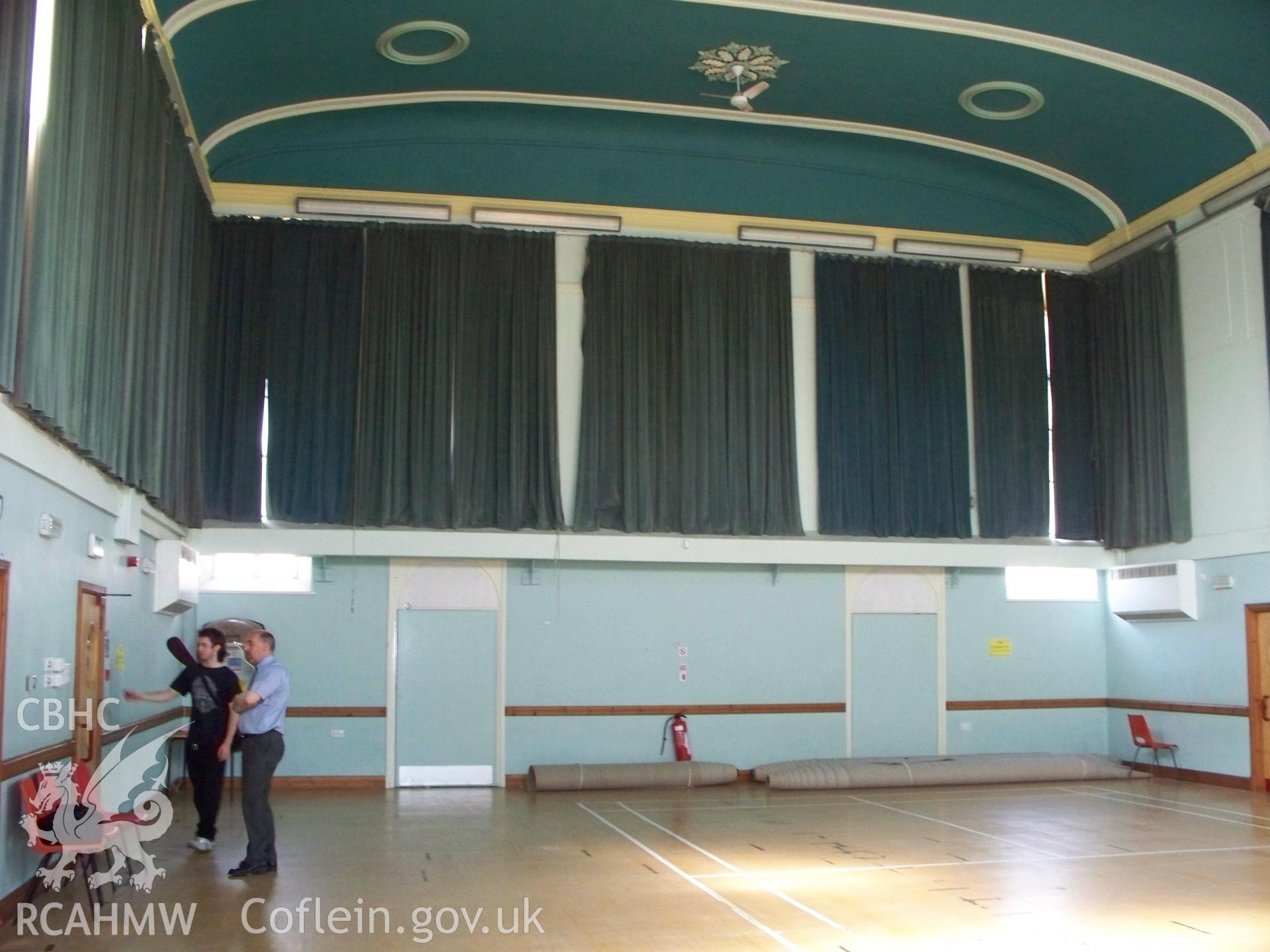 Interior of NW front with curtains drawn over windows.