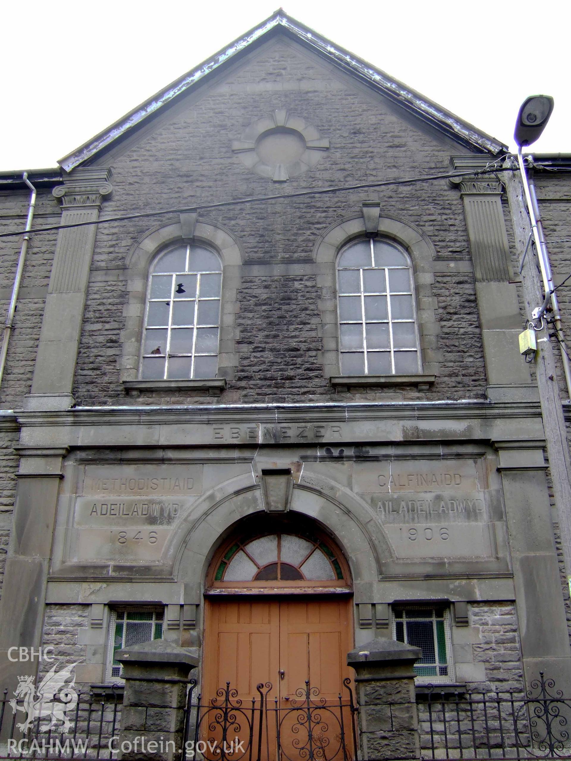 Entrance centerpiece added in 1906 to earlier lateral-fronted chapel of 1846 as inscription notes.