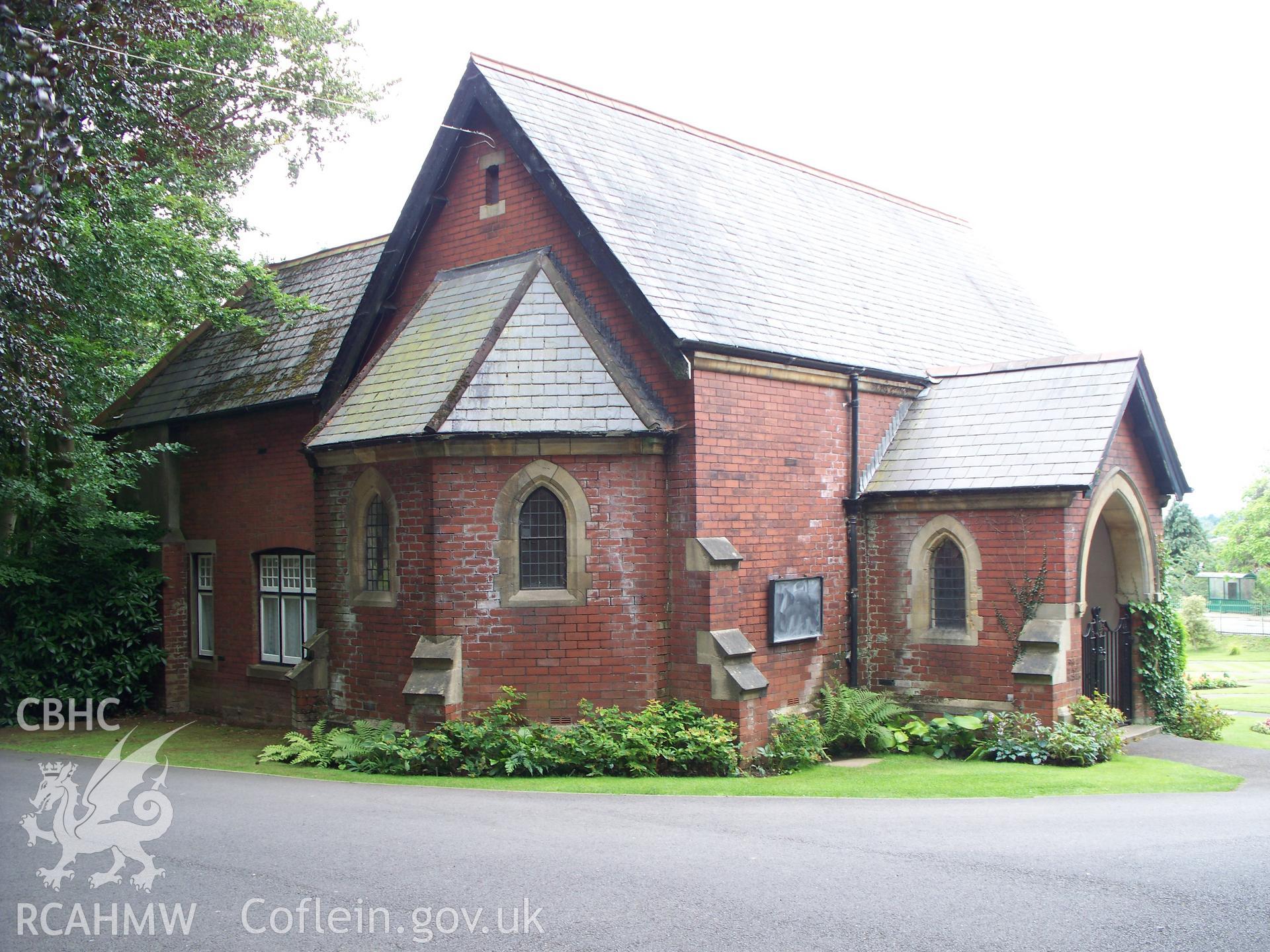 War memorial and cemetery chapel beyond.